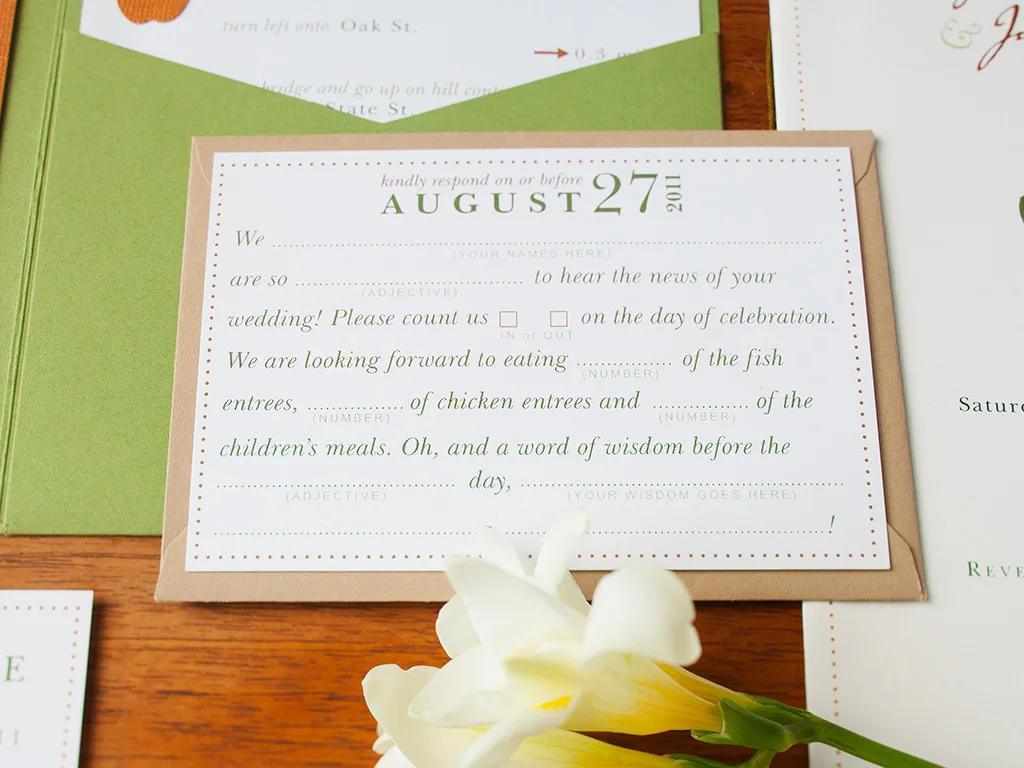Mossy green, apple red and autumn orange rustic fall invitation design. Includes a moss green envelopment, main invite, R.S.V.P. mad libs card, save the date postcard, program and custom map of local area with nearby must-see places recommended by the couple and directions to the ceremony to the reception. All items enclosed in a kraft paper envelope.