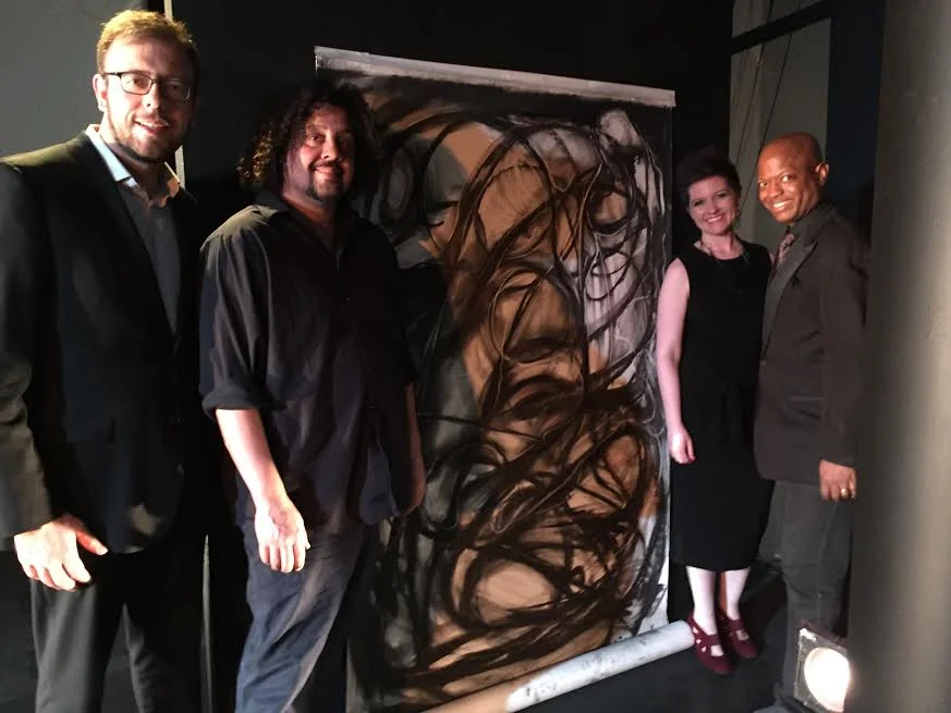 Brian Holman, Byron Singleton and artist Rufino Jimenez with the piece he created during Les Illuminations. 