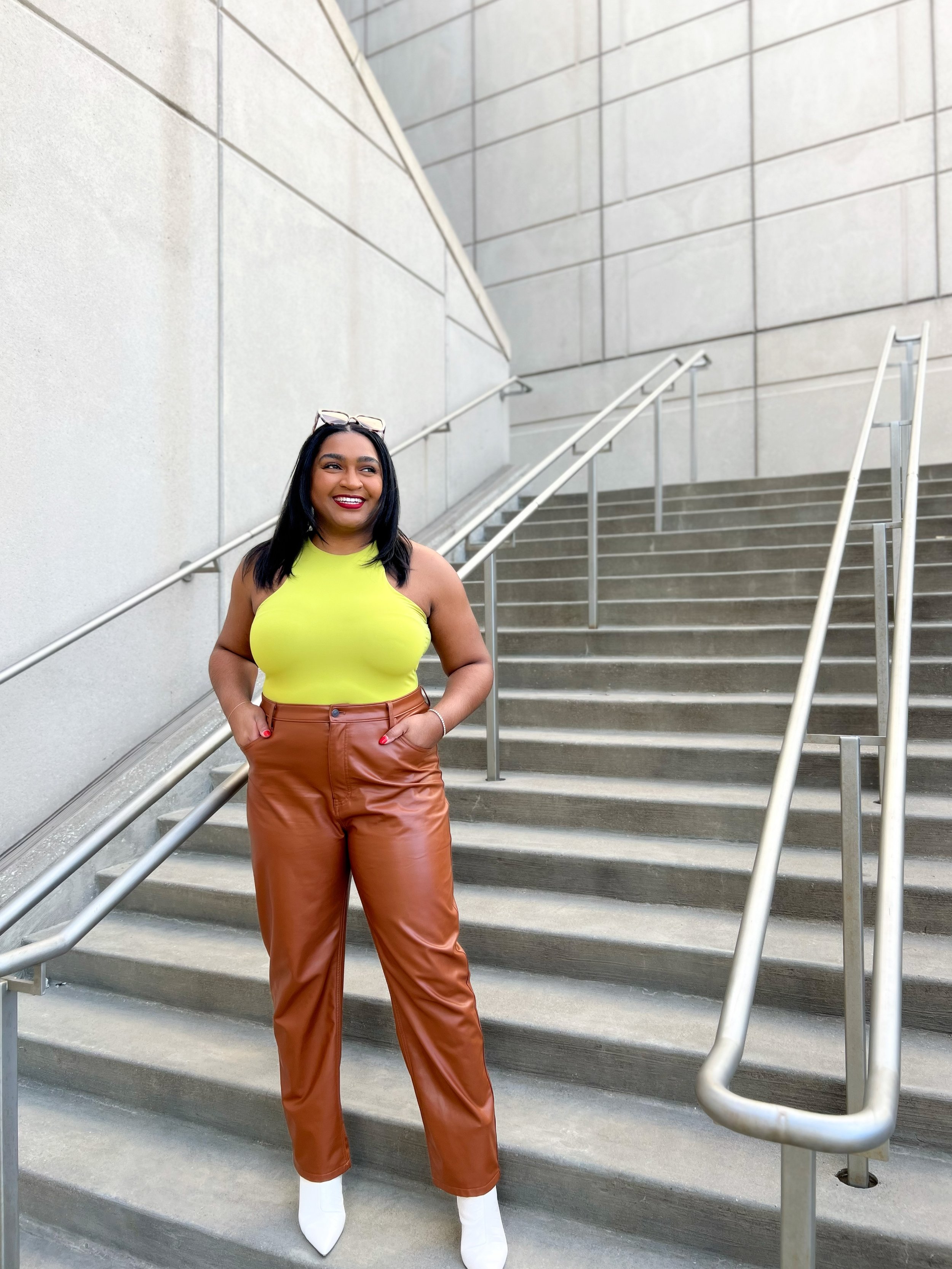 top kansas city blogger jasmine diane wearing spring 2023 green tank and leather pants with boots.jpg