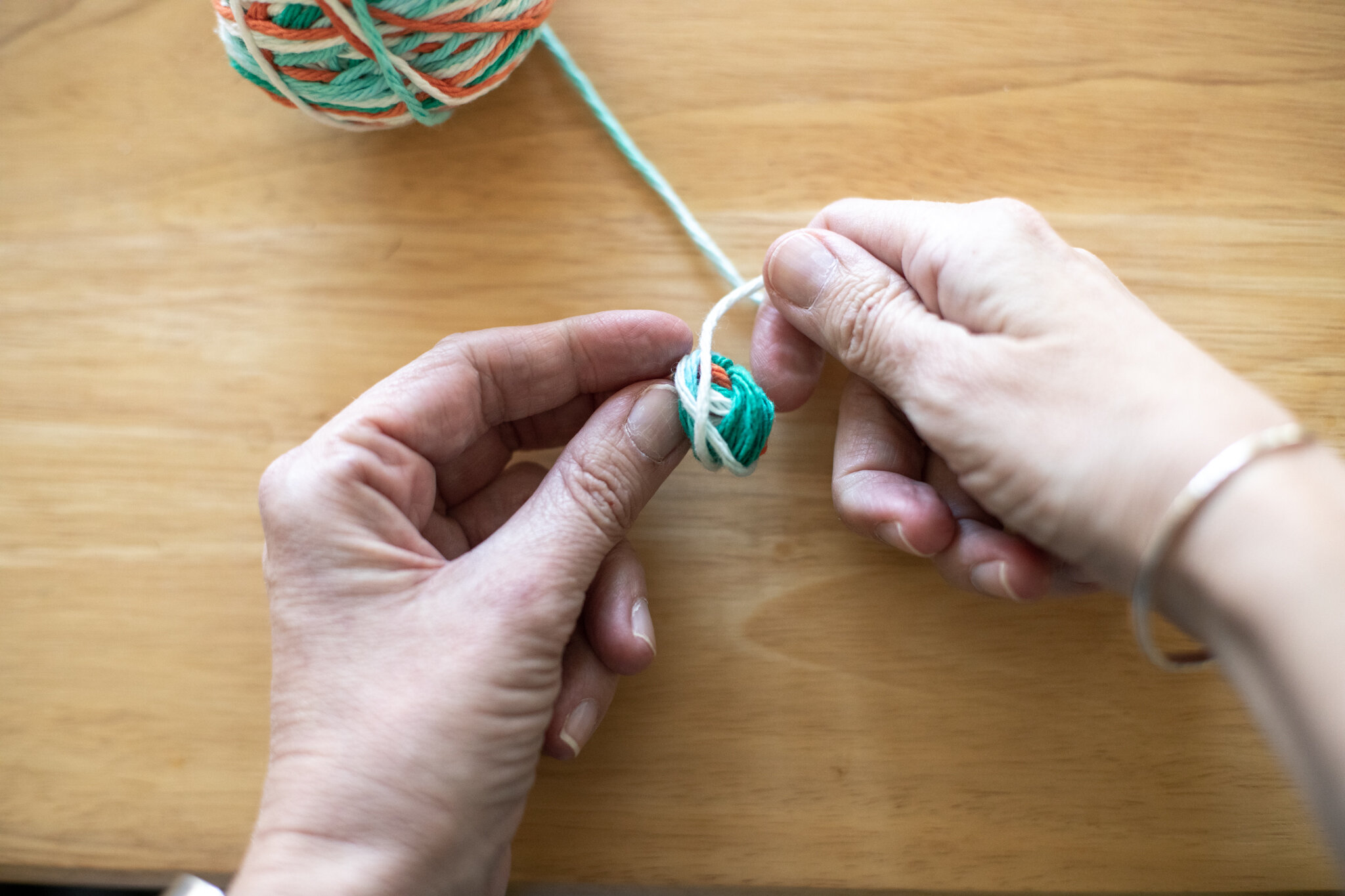  Continue to wrap and turn your yarn every few times your build up the ball. Now it’s taking shape. You can turn it to add yarn to sides that need more. 