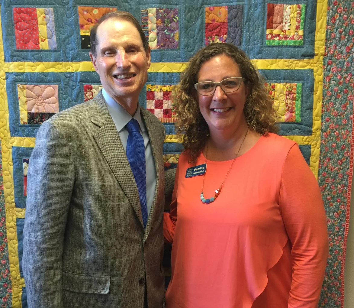 Sen. Wyden visits with staff at a HFA site in Salem, OR.