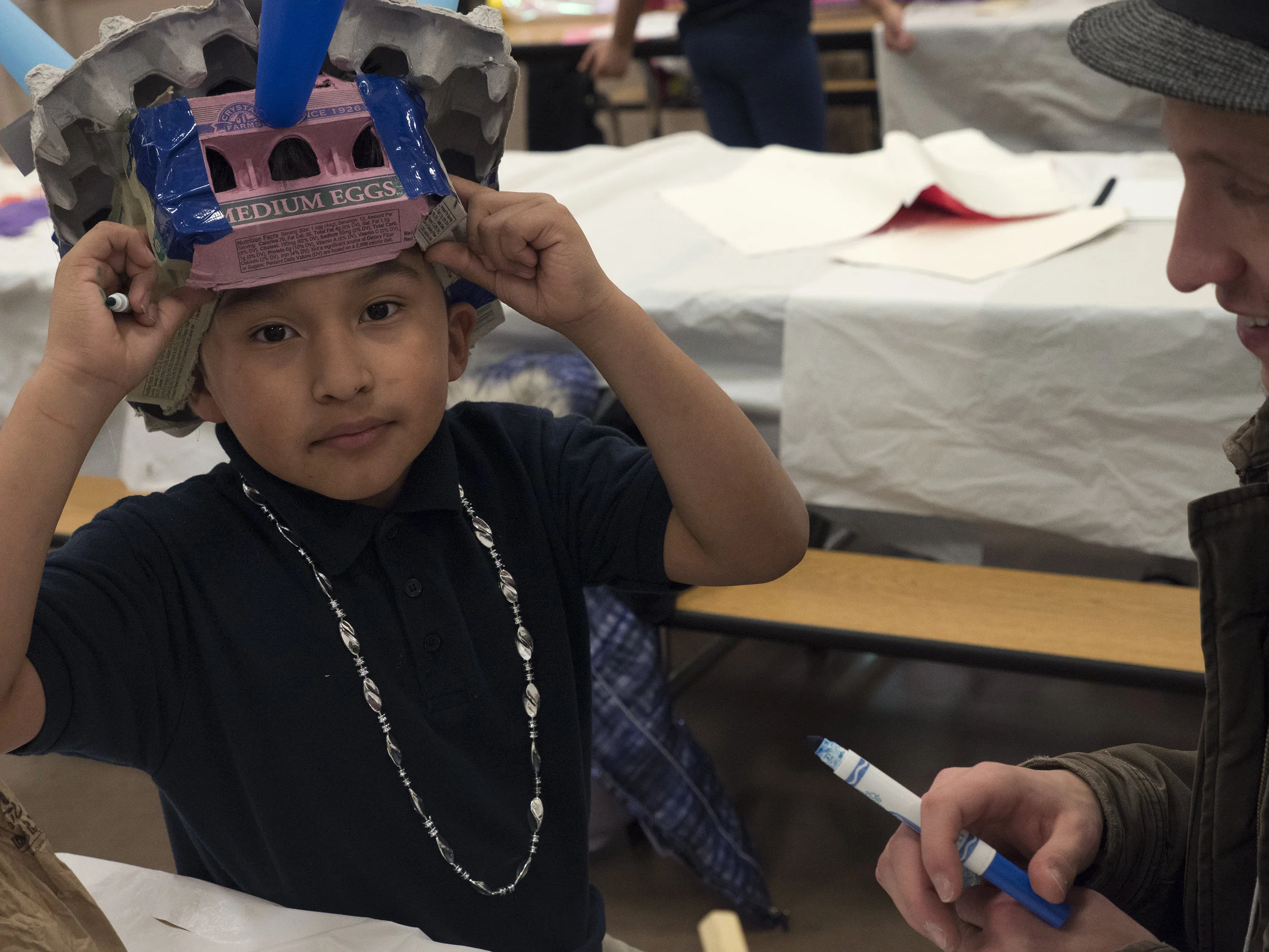 12/2107-Minneapolis, St. Paul, MN - Art Buddies. Kids make costumes with materials from bins of crafts.