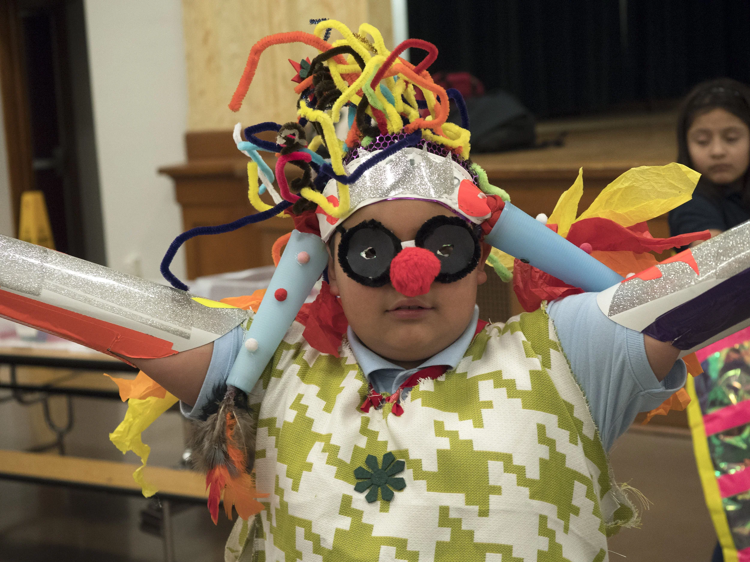 12/2107-Minneapolis, St. Paul, MN - Art Buddies. Kids make costumes with materials from bins of crafts.