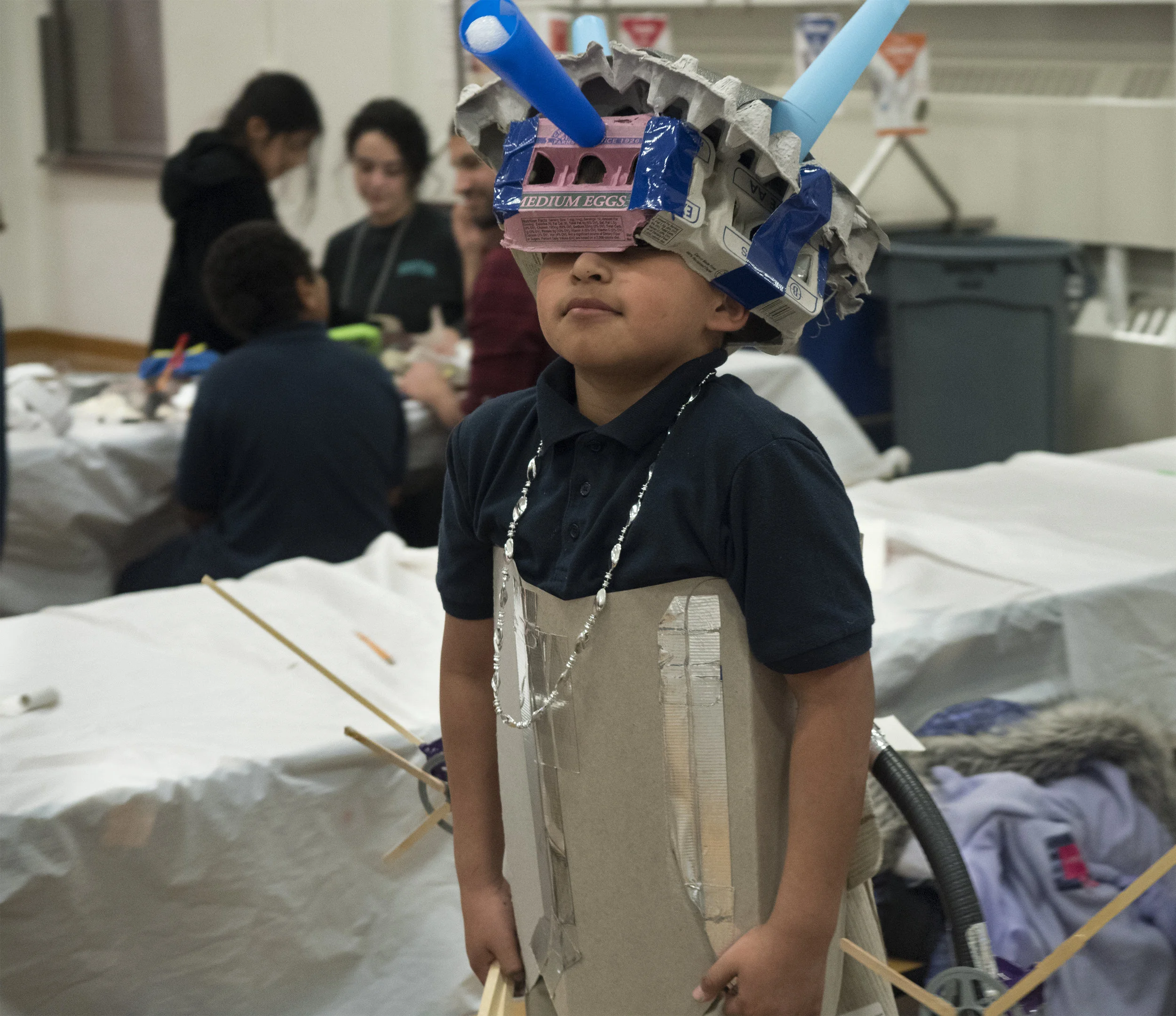 12/2107-Minneapolis, St. Paul, MN - Art Buddies. Kids make costumes with materials from bins of crafts.