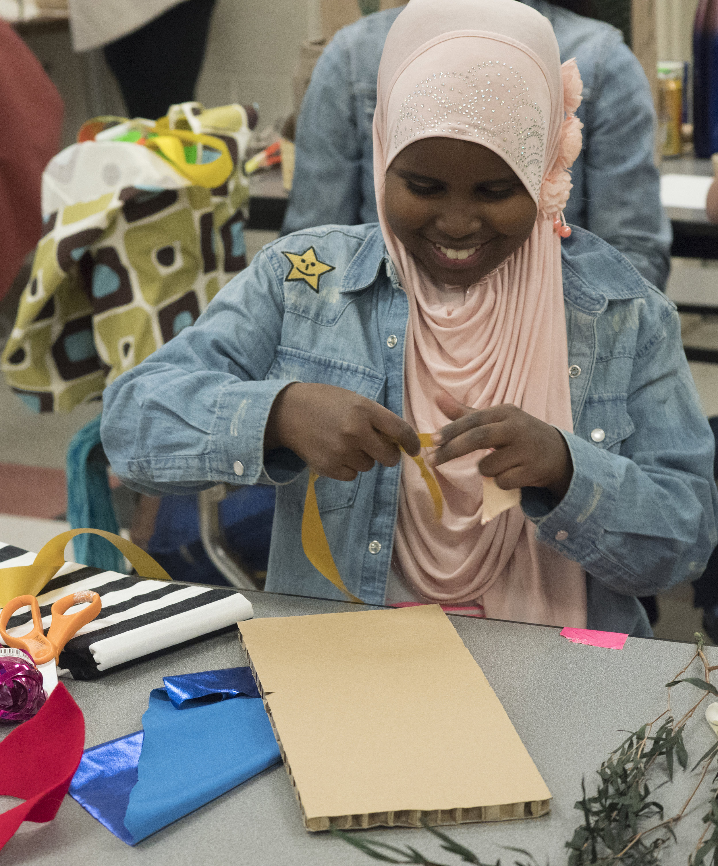  12/2107-Minneapolis, St. Paul, MN - Art Buddies. Kids make costumes with materials from bins of crafts.  