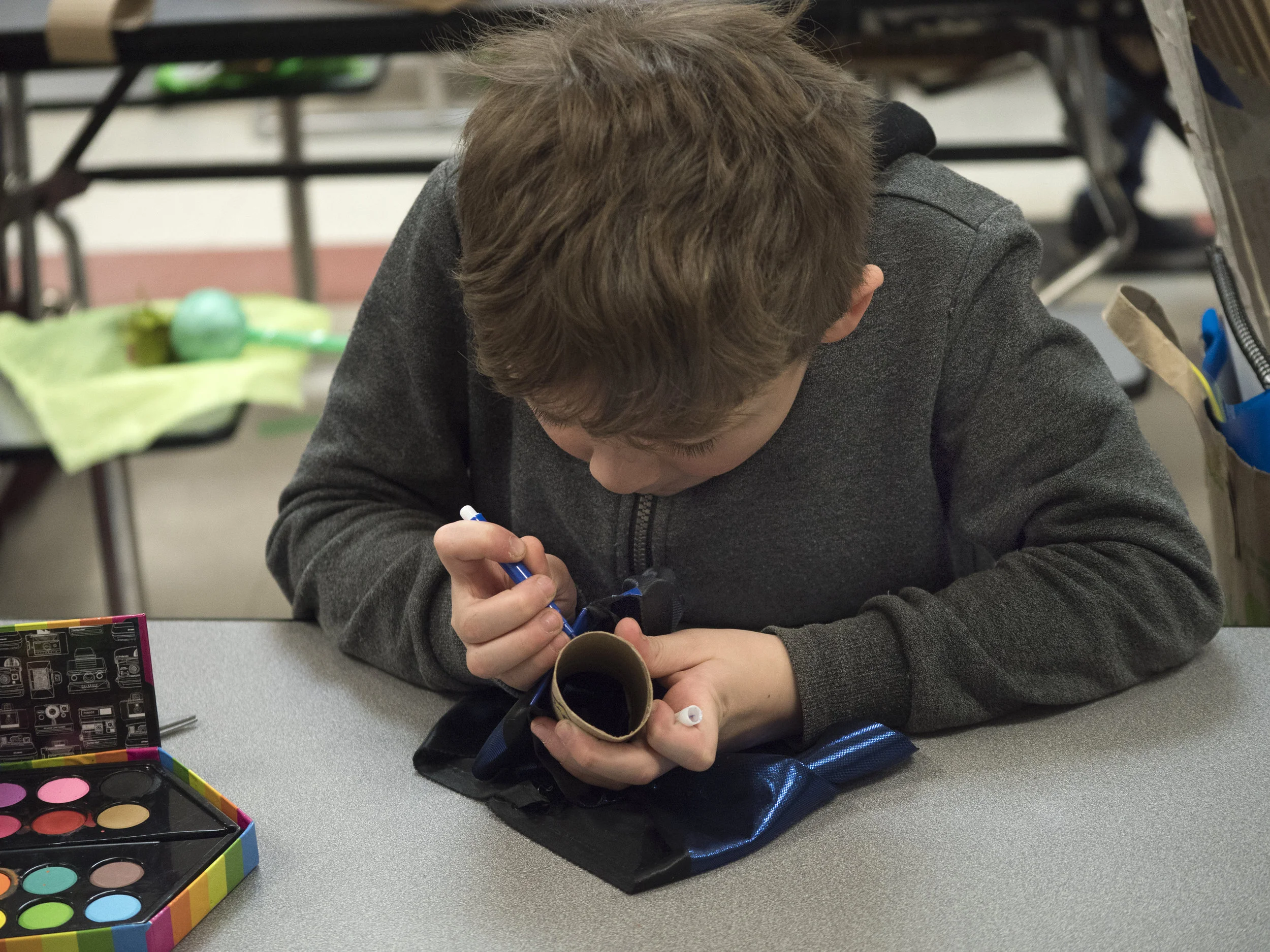 12/2107-Minneapolis, St. Paul, MN - Art Buddies. Kids make costumes with materials from bins of crafts.