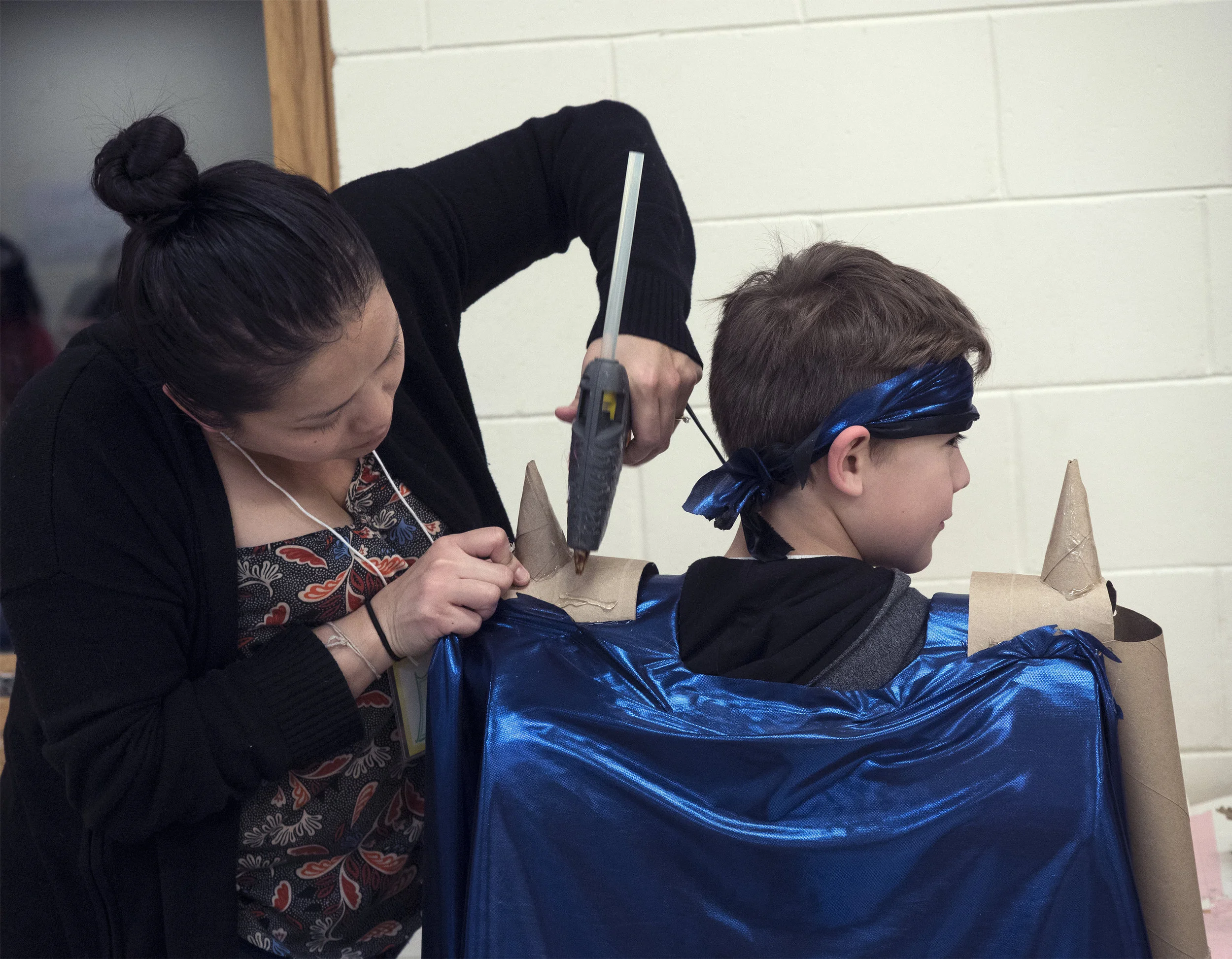 12/2107-Minneapolis, St. Paul, MN - Art Buddies. Kids make costumes with materials from bins of crafts.