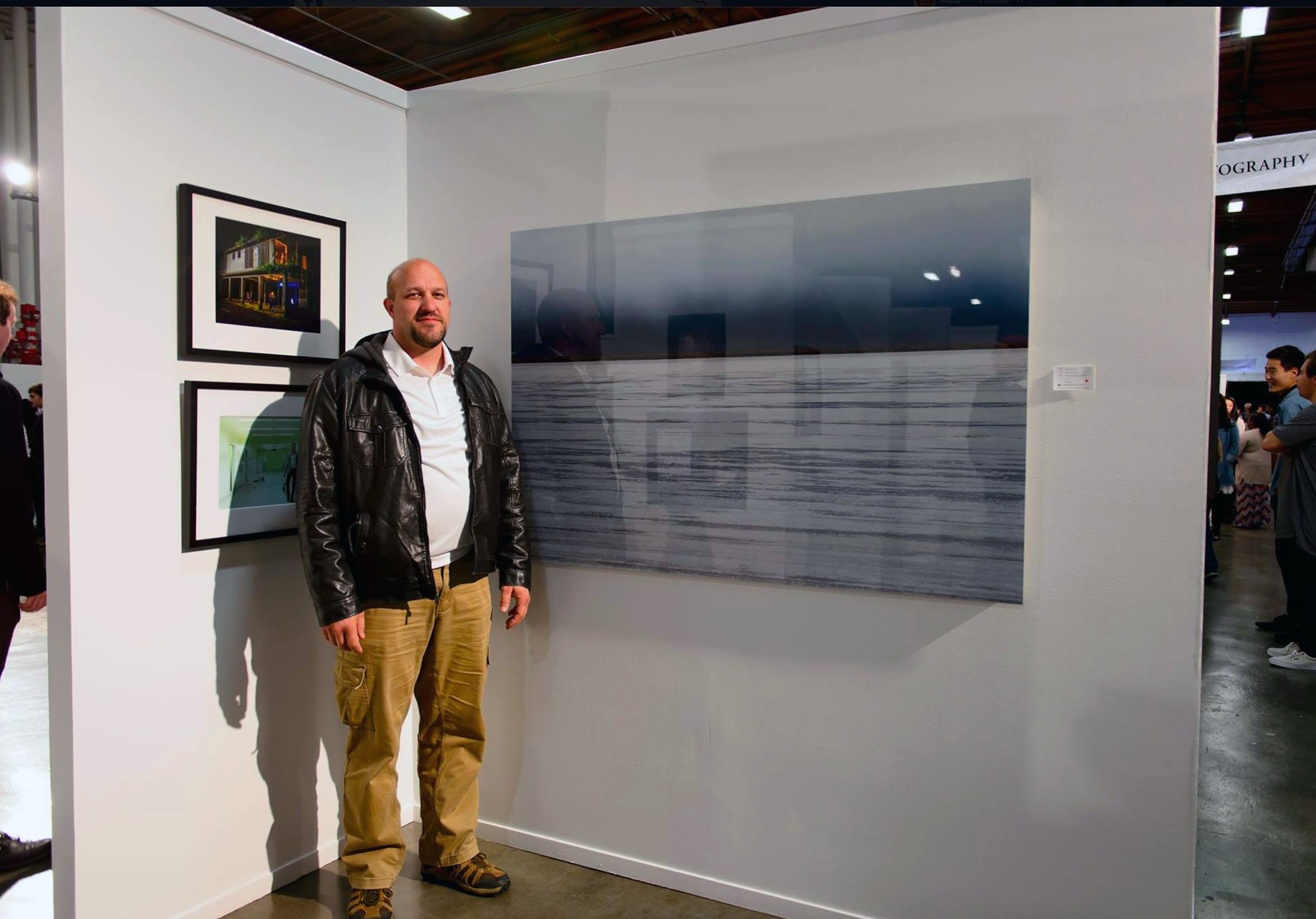 School of Photography MFA Graduate Stephen Parsons next to his 2016 Spring Show entry, "Bonneville Salt Flats."