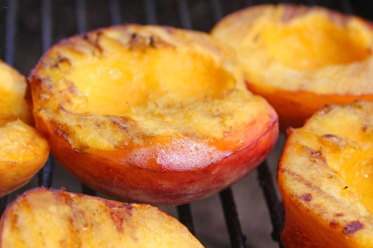 Grill the peaches with the oiled cut-side down