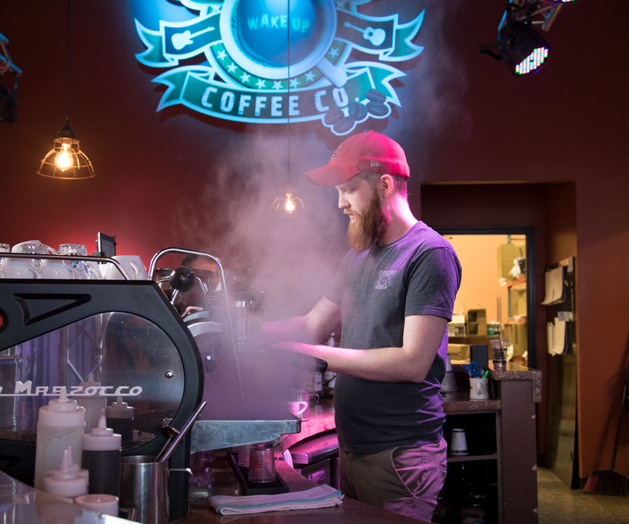 MASTER CRAFTSMAN: Barista Jonathan Mizer makes a latte at Classic Rock Coffee.
