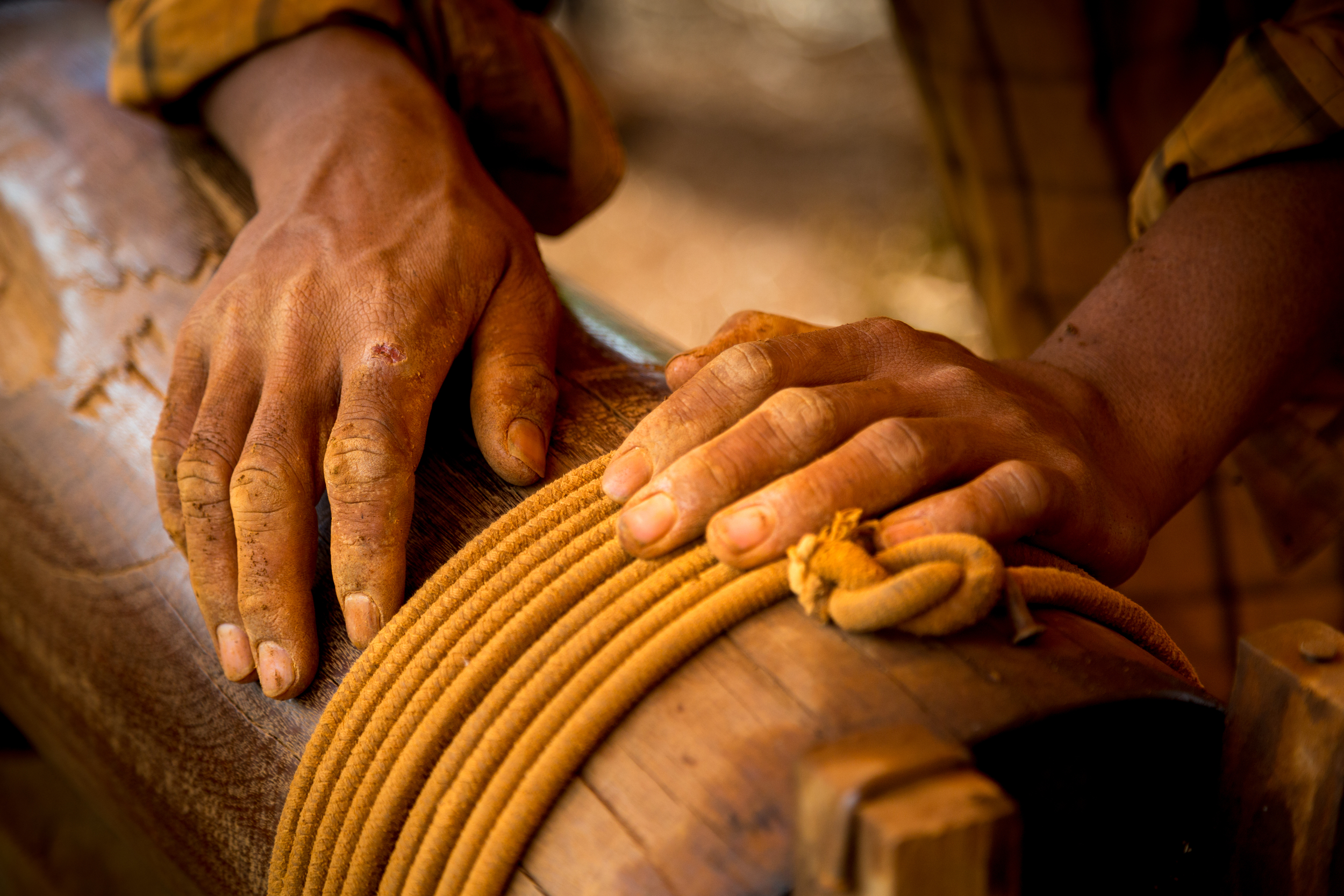 Mining for gems is a three man operation. The men take it in turns descending into the ladder-less mines. They spend up to an hour below ground digging and filling buckets of earth to be sent to the surface. The second miner turns a makeshift rope mechanism that brings the soil above ground to be hand sifted by the third team member.