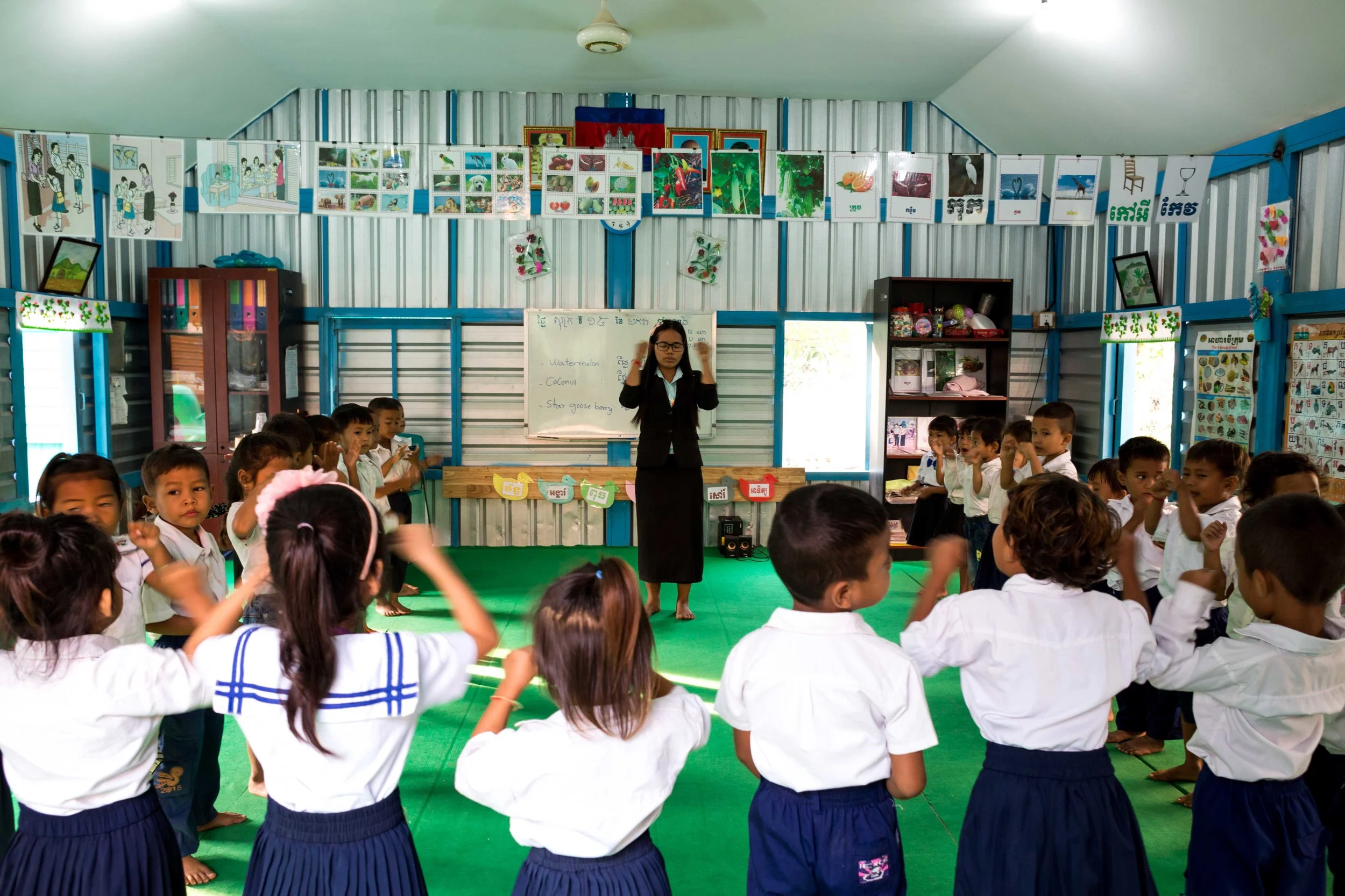Kindergarten classes begin with English lessons for kindergarten kids at the Phare Ponleu Selpak School in Battambang, Cambodia. The Phare Ponleu Selpak School (which translates to the ‘brightness of the arts’) began life in 1986 at a refugee cam p on the Thai-Cambodian border. A group of 9 children who had taken part in drawing classes had the idea to form a creative group to help other children express the traumas of war. Following their repatriation in 1994, the Phare Ponleu Selpak School in Battambang was born to give free education of the arts to all children, with no waiting lists. 