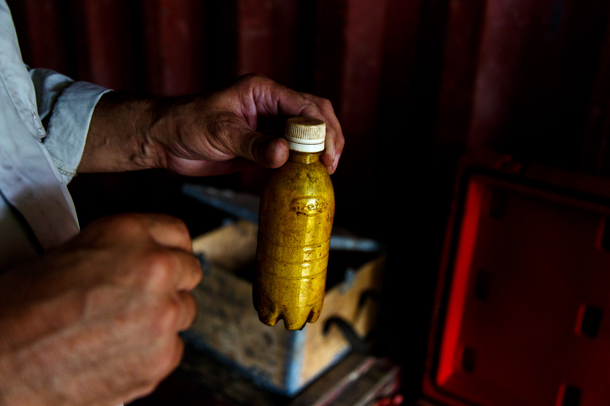  Golden West Humanitarian Foundation Project Manager Paul Eldred holds up a crude bomb which was confiscated by the Royal Solomon Islander Police Force Explosive Ordnance Disposal team. The bomb is used for dangerous dynamite fishing practices which 