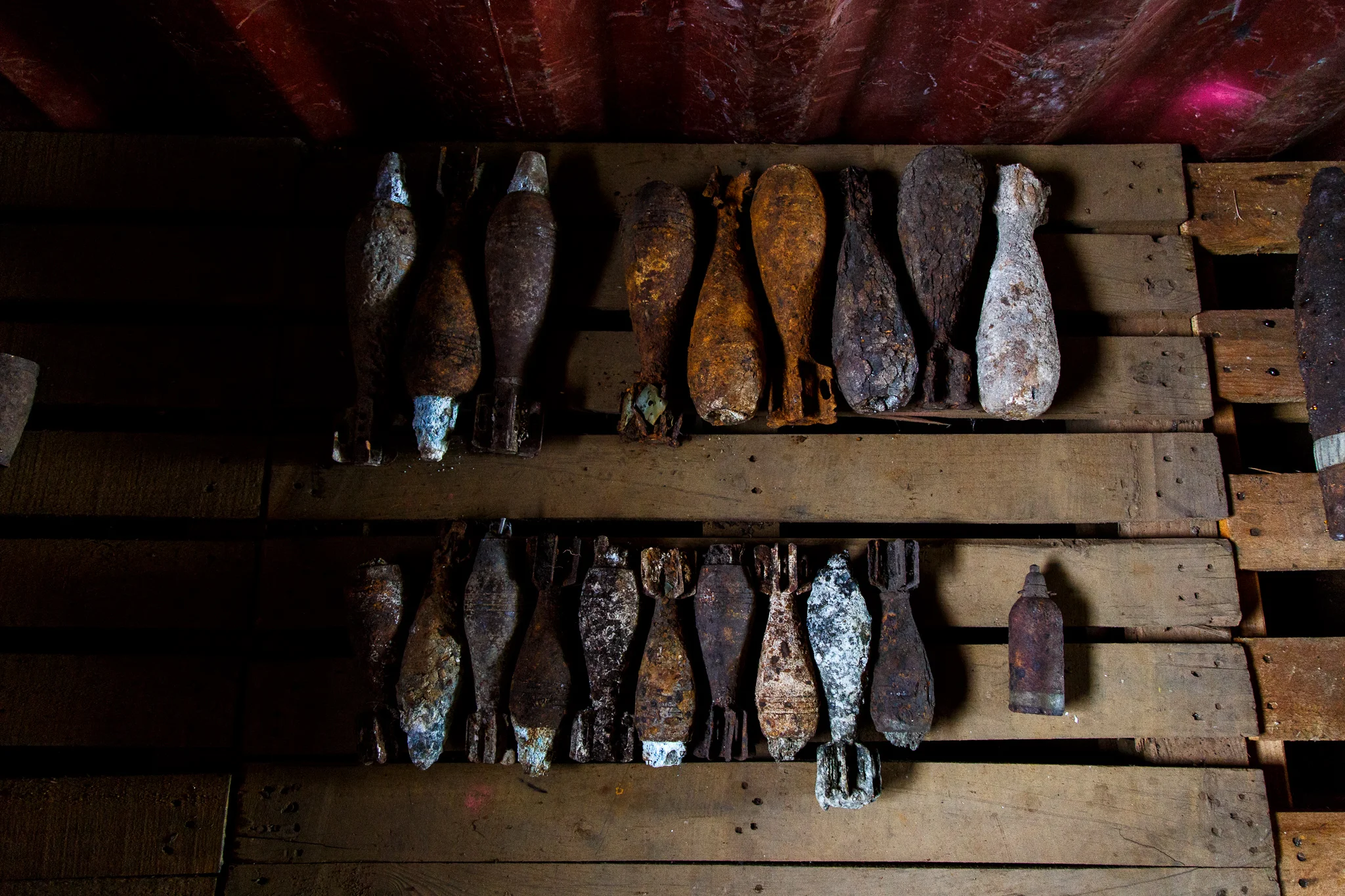  Corroded and unstable UXO from World War Two awaiting disposal are kept in storage containers at the Hells Point Detonation range in Honiara. Since Golden West took over the training at Hells Point in 2011 the Explosive Ordnance team have found and 