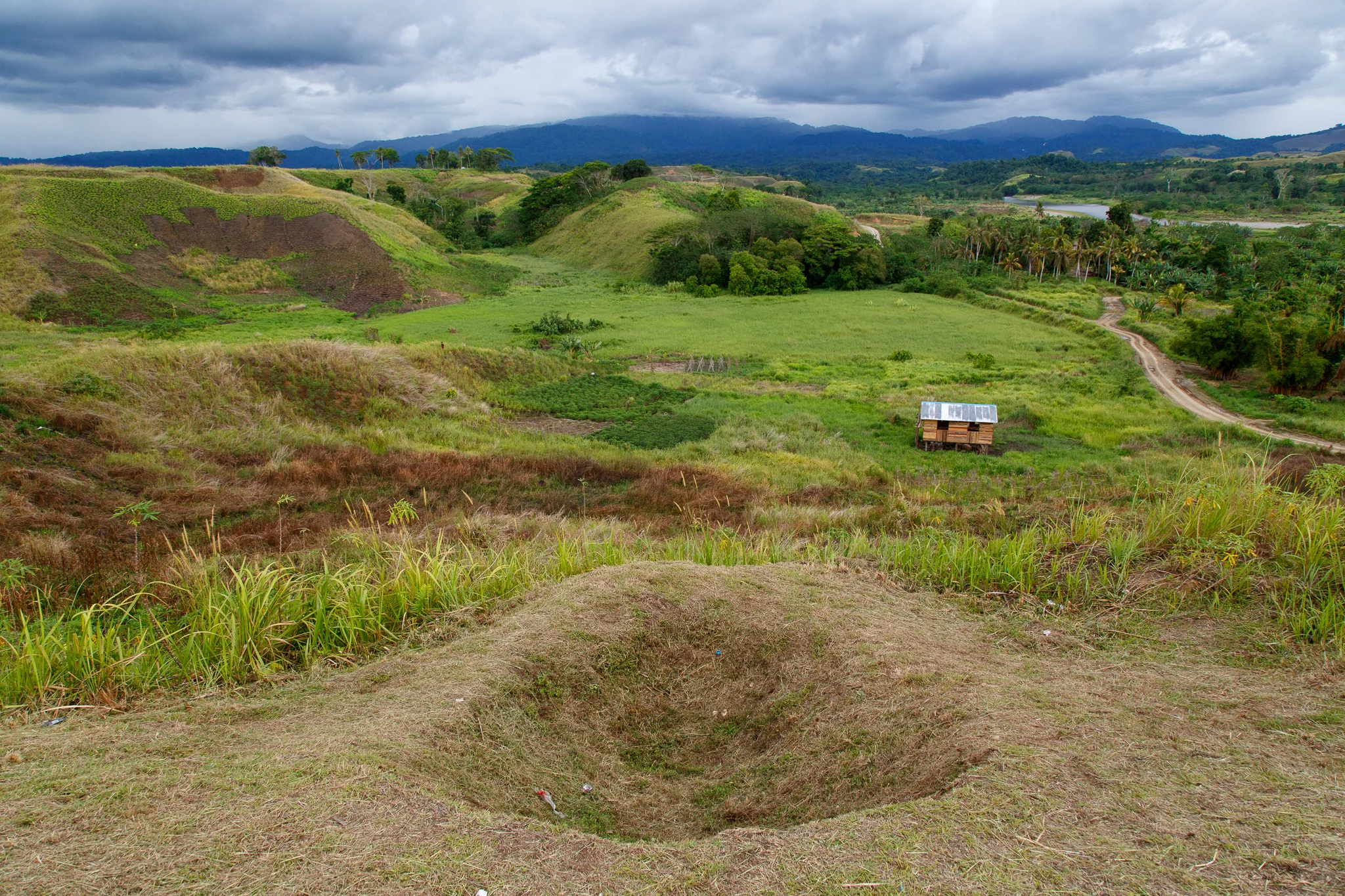  Fox holes still scar the landscape around the hills of Bloody Ridge, just outside of Honiara. They are a physical reminder of the war which has ended for some, still continues to be waged on those living with the devastating legacy of UXO. Bloody Ri