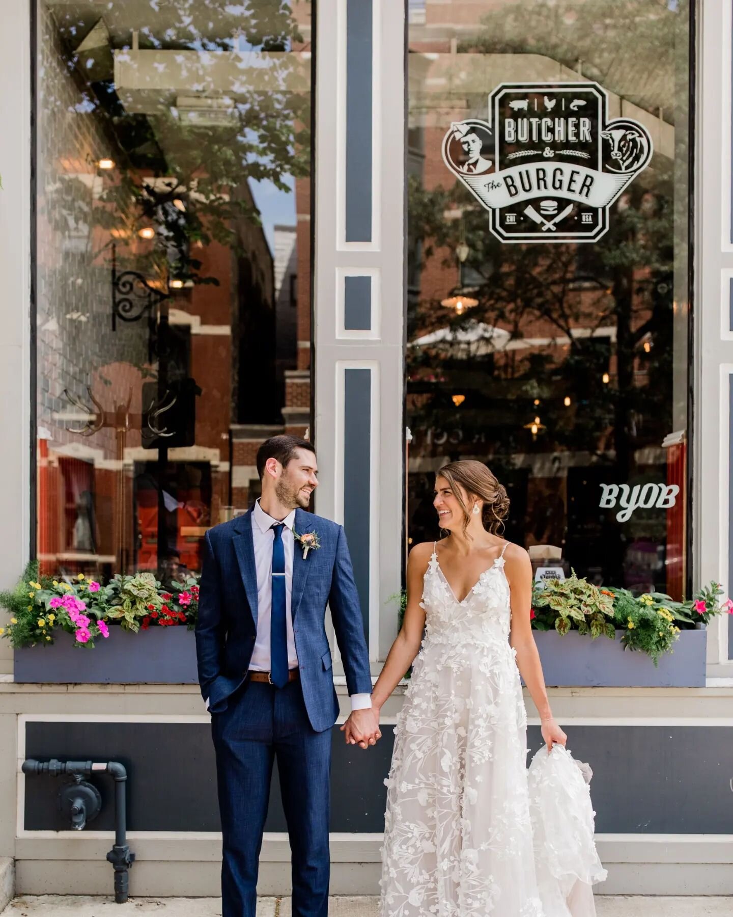 During our photo time, we stopped at Jane and Ryan's first date spot @butcherandtheburger. It was so cool to come full circle with them as they stood there as a bride and groom. 🍔