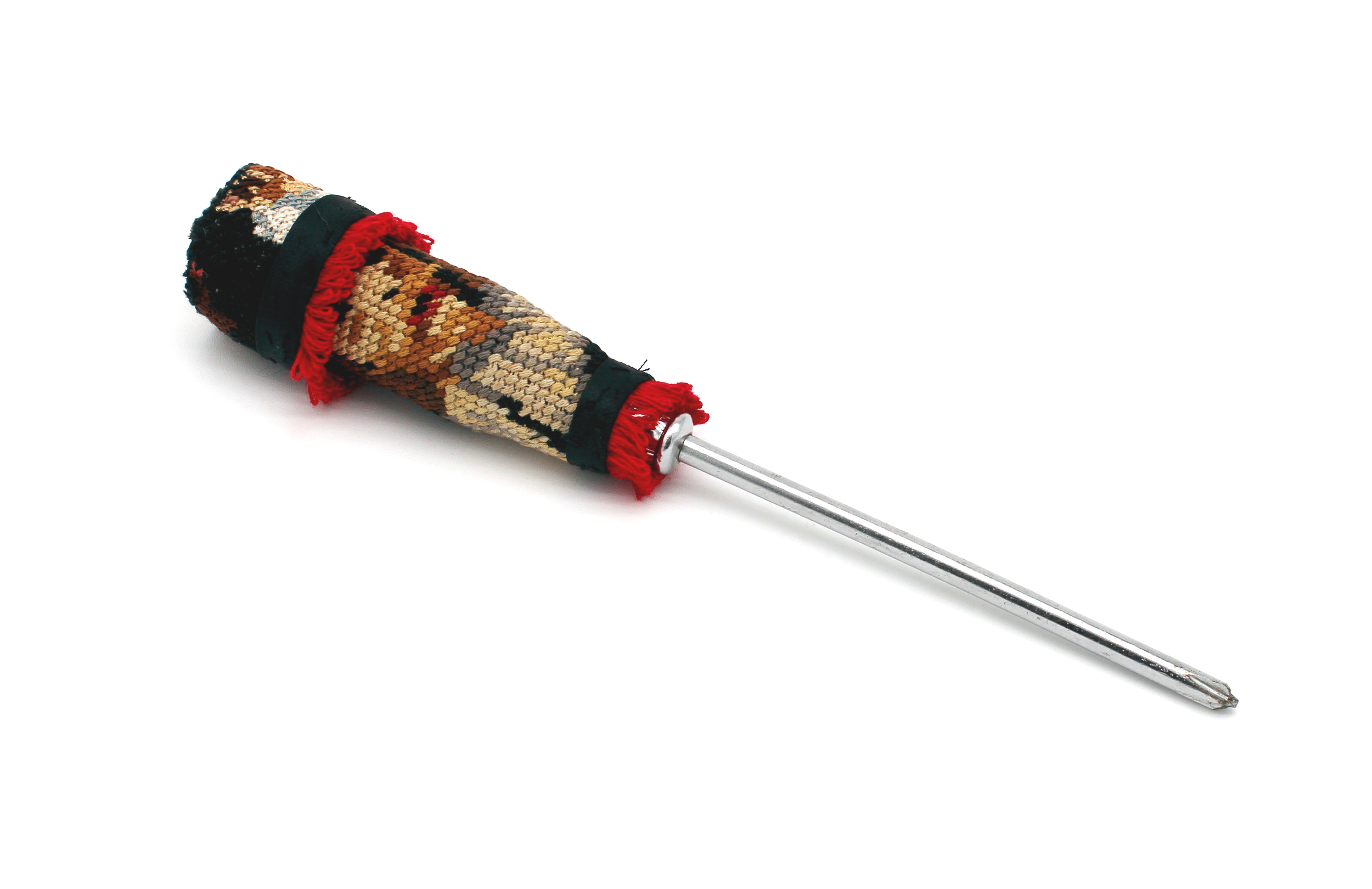 A flathead screwdriver with a fabric-covered handle embellished with red fringe
