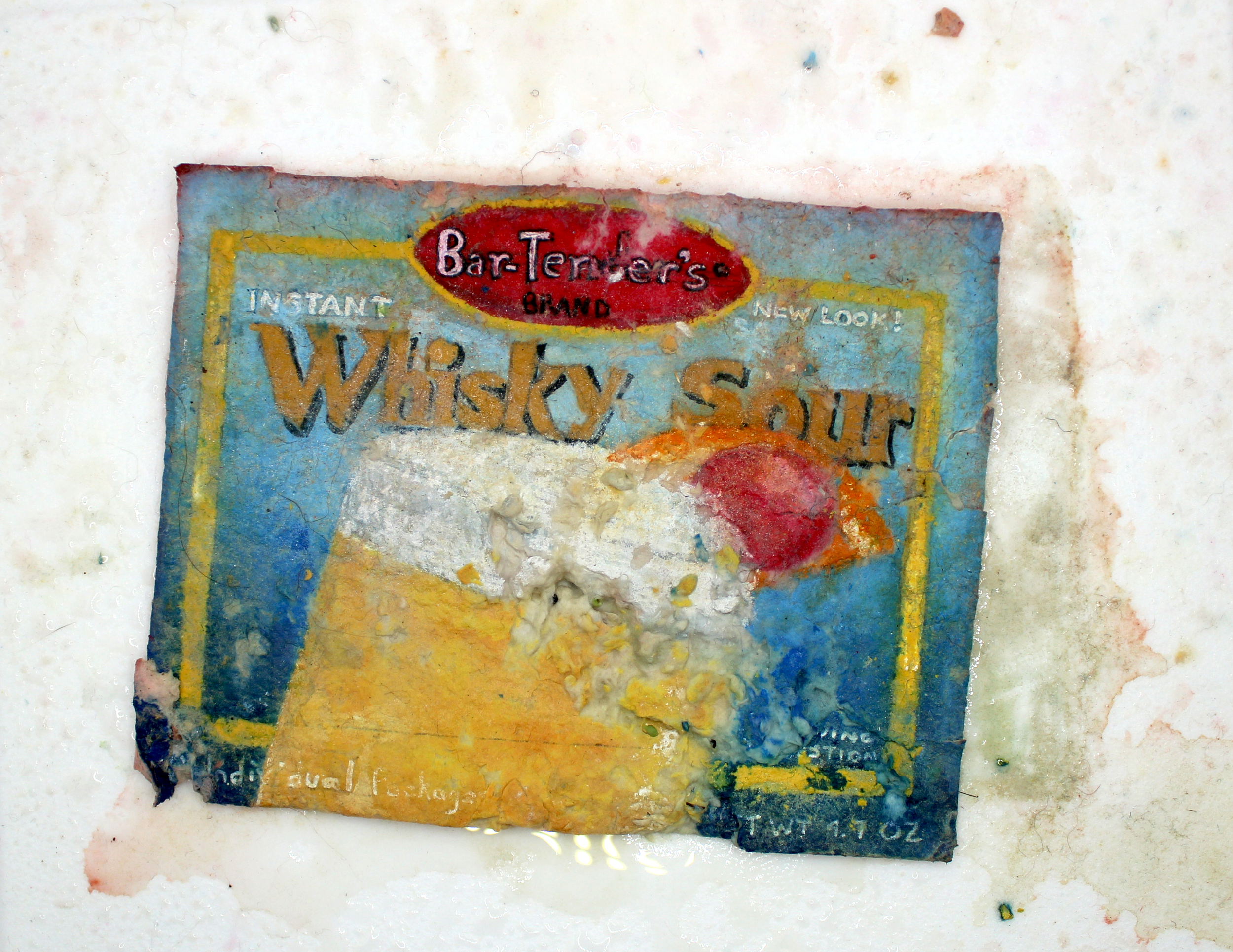 A painting made to look like a package of whiskey sour mix