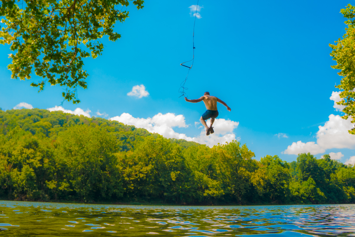Kyle King (owner of White Birch Juice Co. ) taking flight above the New. This was probably 1 of 100 times we hit the swing!