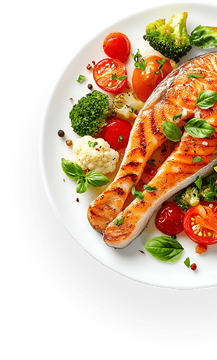 Grilled salmon fillet with cherry tomatoes, broccoli, cauliflower, and fresh basil on a white plate