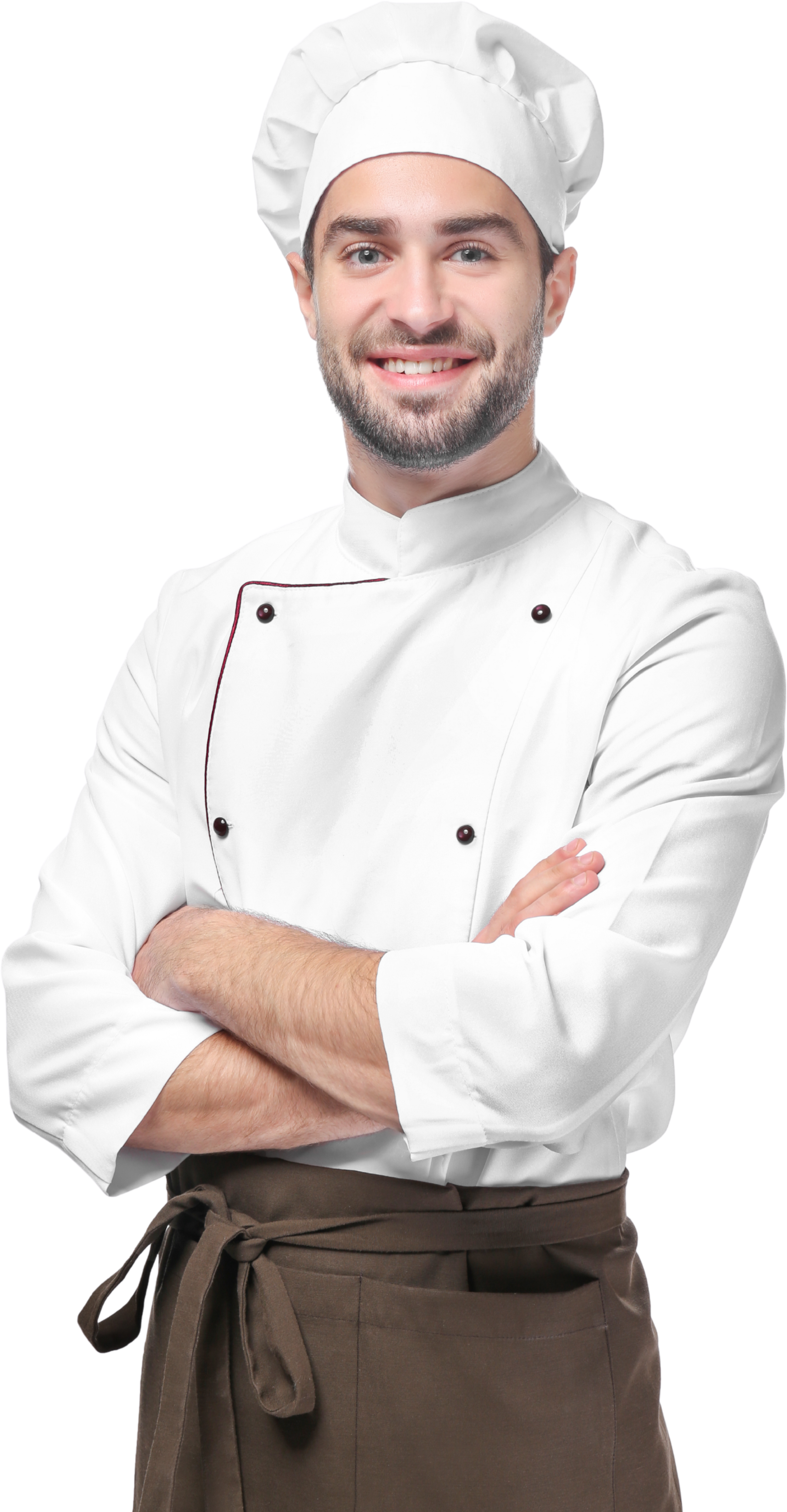 A smiling chef wearing a white chef's coat, a traditional chef's hat, and an apron with arms crossed.