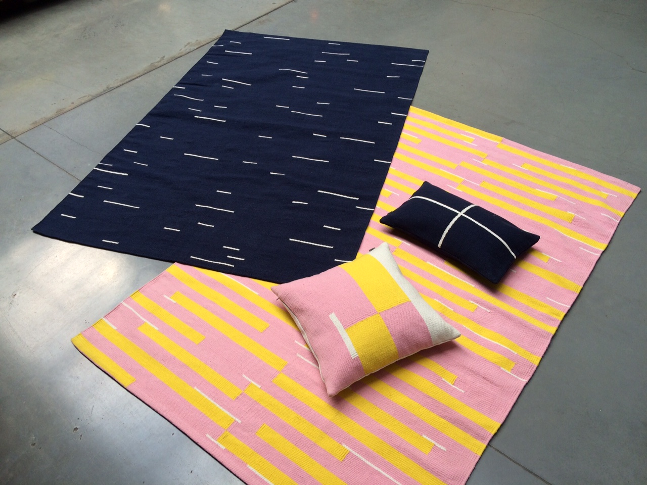 Jama-khan rugs in pink and blue - 120 x 180 cms Jama-khan square cushion - 45 x 45 cms Jama-khan rectangular cushion - 30 x 50 cms. All 100% handwoven cotton