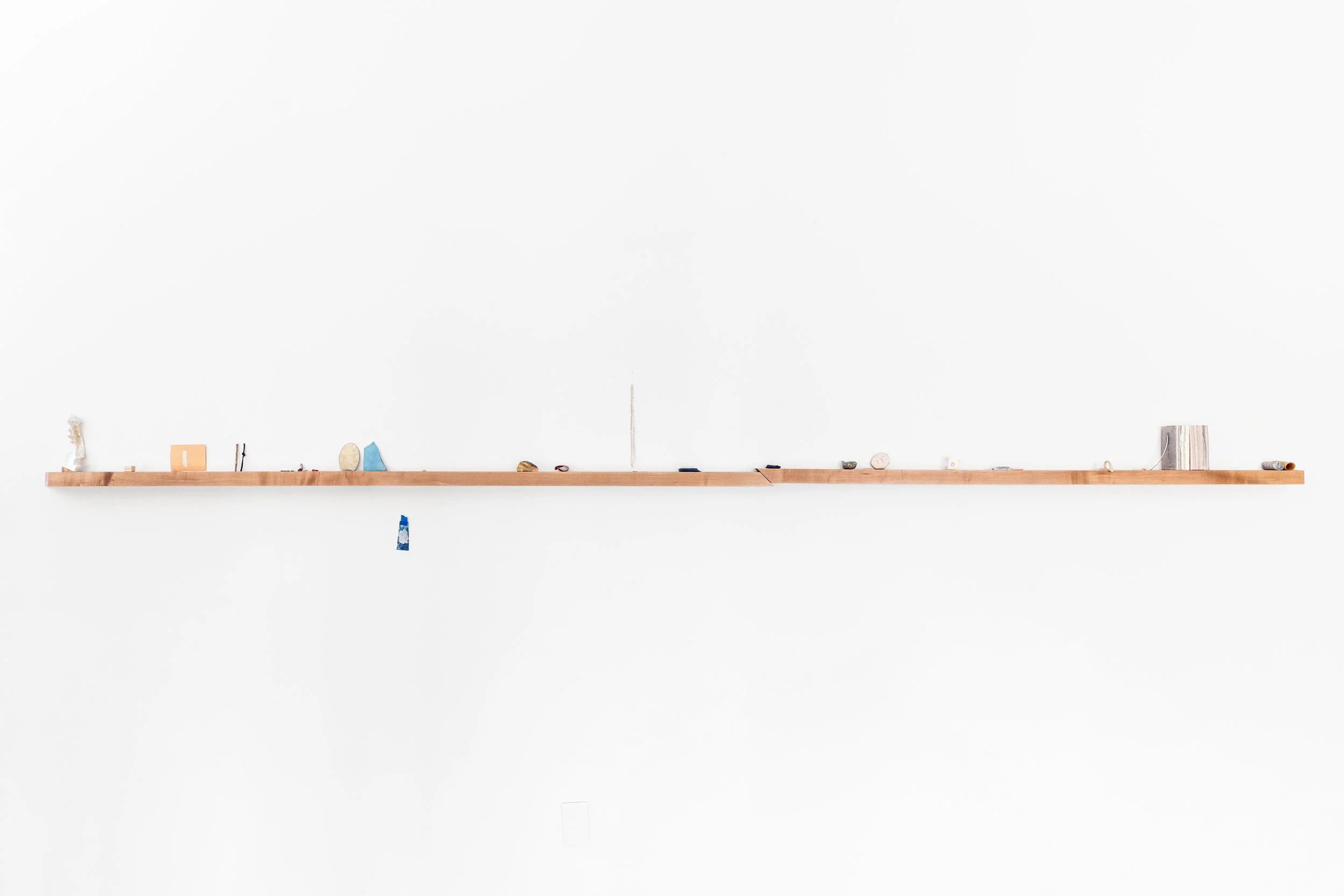 Reverse fault , Memory Foam and plaster (grip), plywood, unfired porcelain on graph paper (bleed), whittled twig, lead knot, sharpened pencil leads, foot of a shocked woman (right), porcelain button, bundle of pink thread, tissue box top cut from nickel silver, unfired sky blue enamel on plexi, single button (cut), what is this grass? (her), bronze cut from the chest of a cast bird, toy bandaid run over in the parking lot (gift), unfired porcelain notebook spines, tack cloth with granite dust /break/ graphite string (unused), pewter bowl with silver segments, a bb, a pellet (unfired), and a setting for a precious stone, string of beads (old), clay impression from a wounded wall, borrowing a hole punch, items from the top dresser drawer, Aqua Resin, handle (found), paraffin wax, fingerprint remnant, portion of a plate’s rim, making my own bricks, rescued pencil eraser (used), granite core fragment, mask making latex (stop), 2019