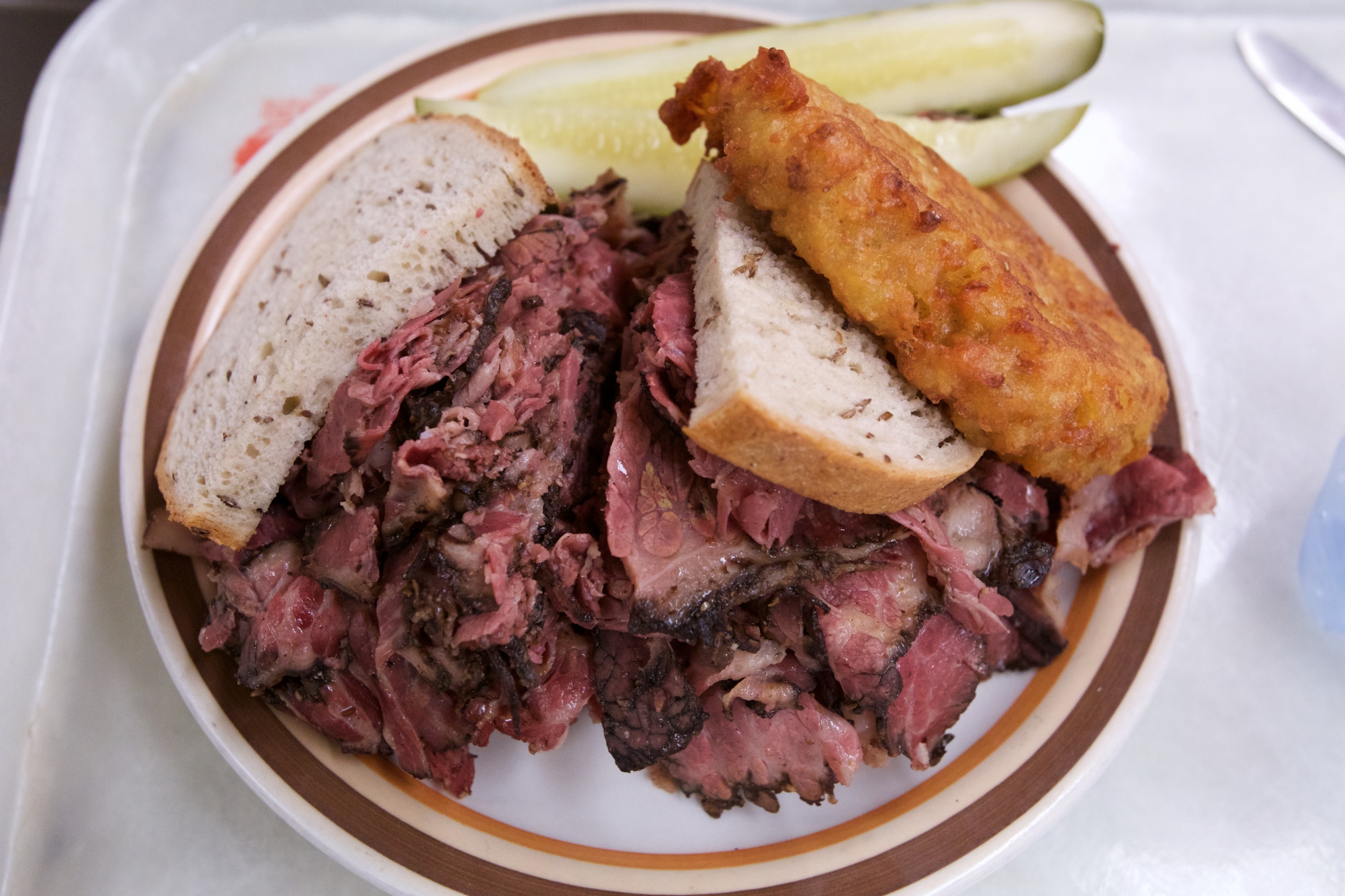 Pastrami sandwich with a potato latke - Manny's Cafeteria &amp;delicatessen