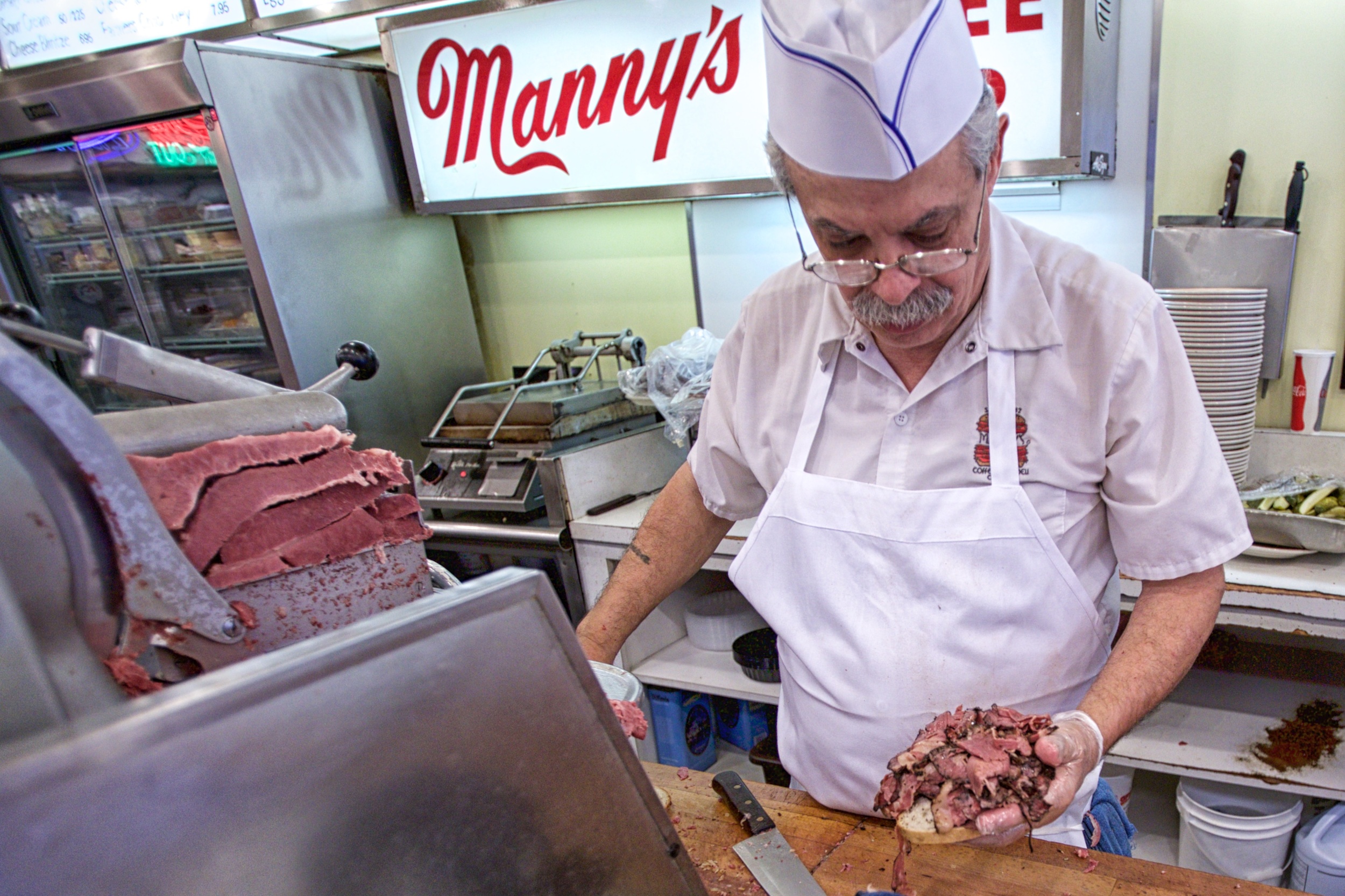 Preparing a pastrami sandwich at Manny's Cafeteria &amp; Delicatessen