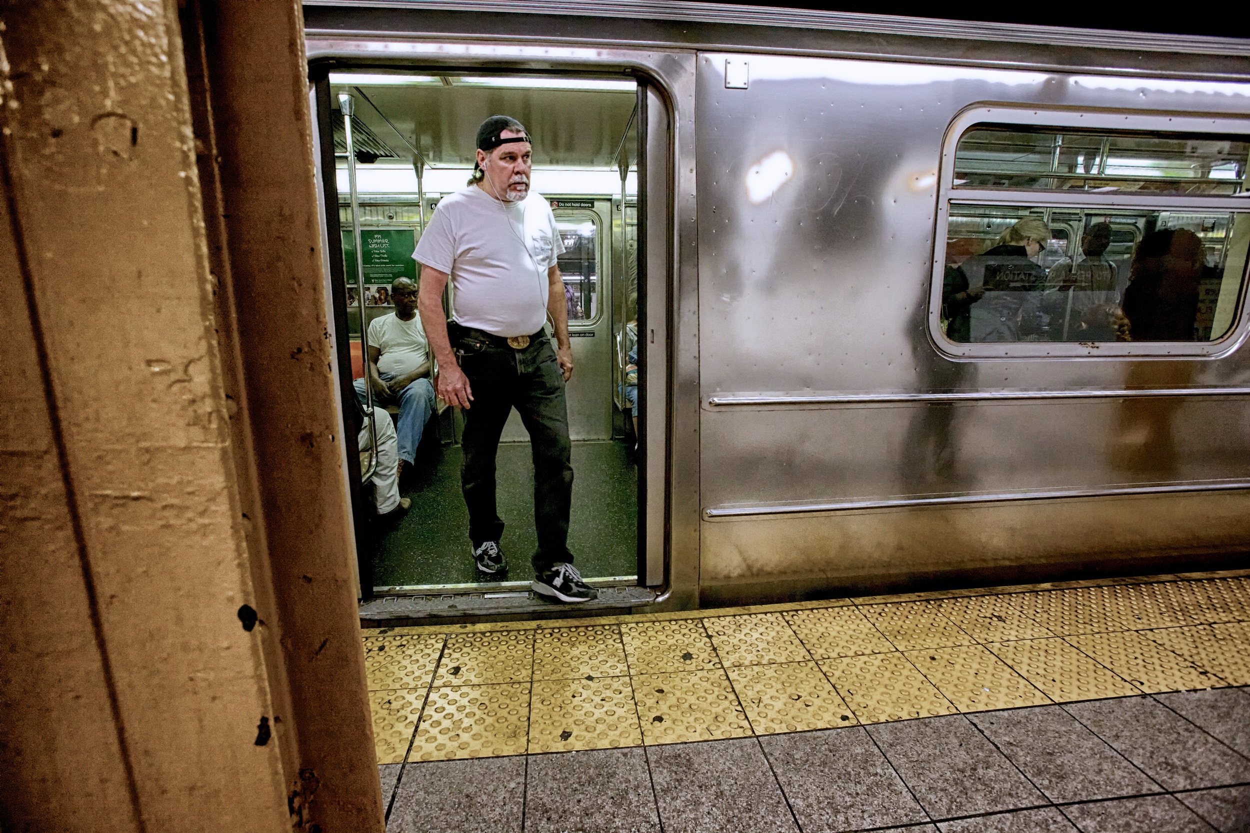 WATCH YOUR STEP AS YOU EXIT THE SUBWAY TRAIN.