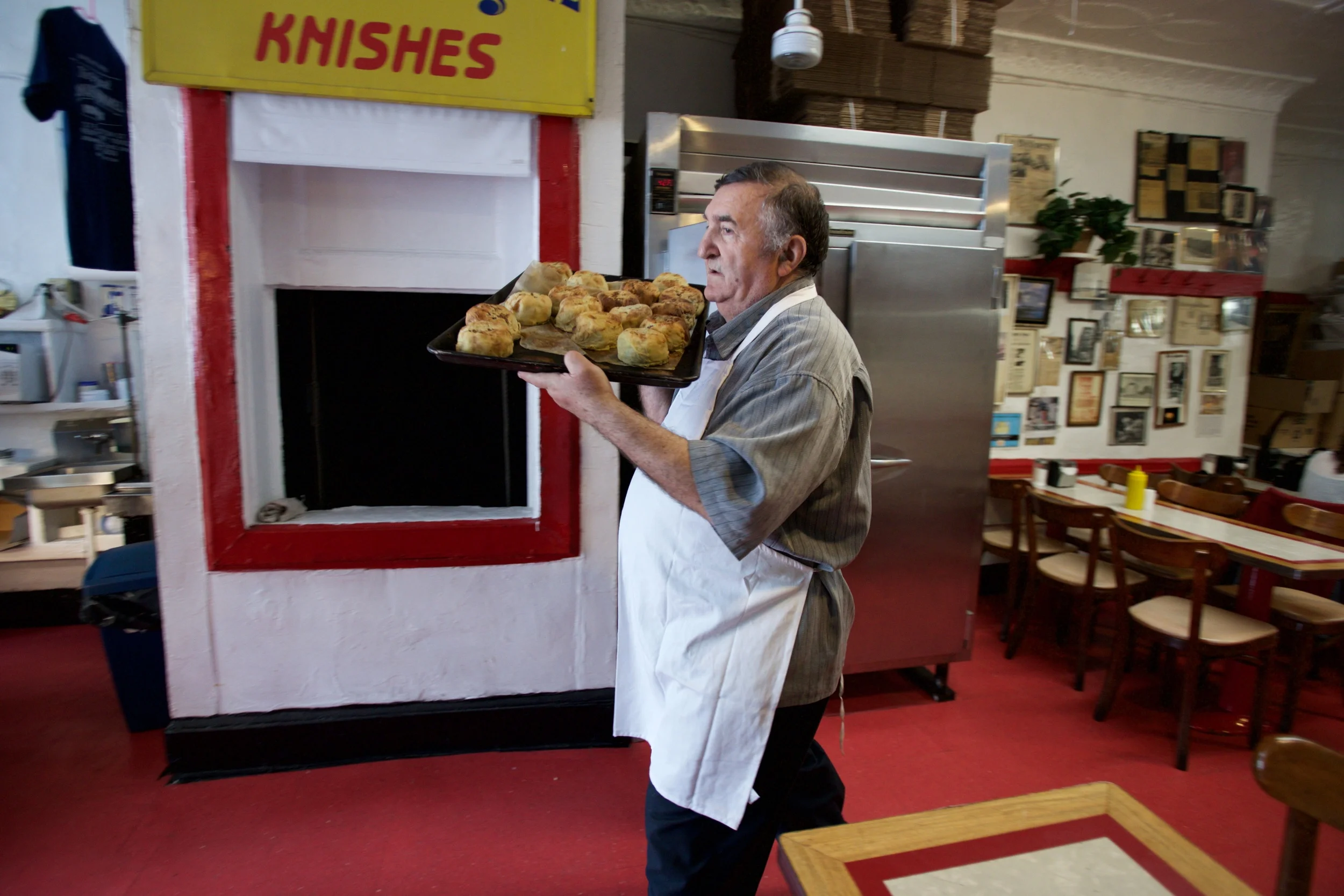 ALEX WOLFMAN CARRYING A TRAY OF FRESH KNISHES