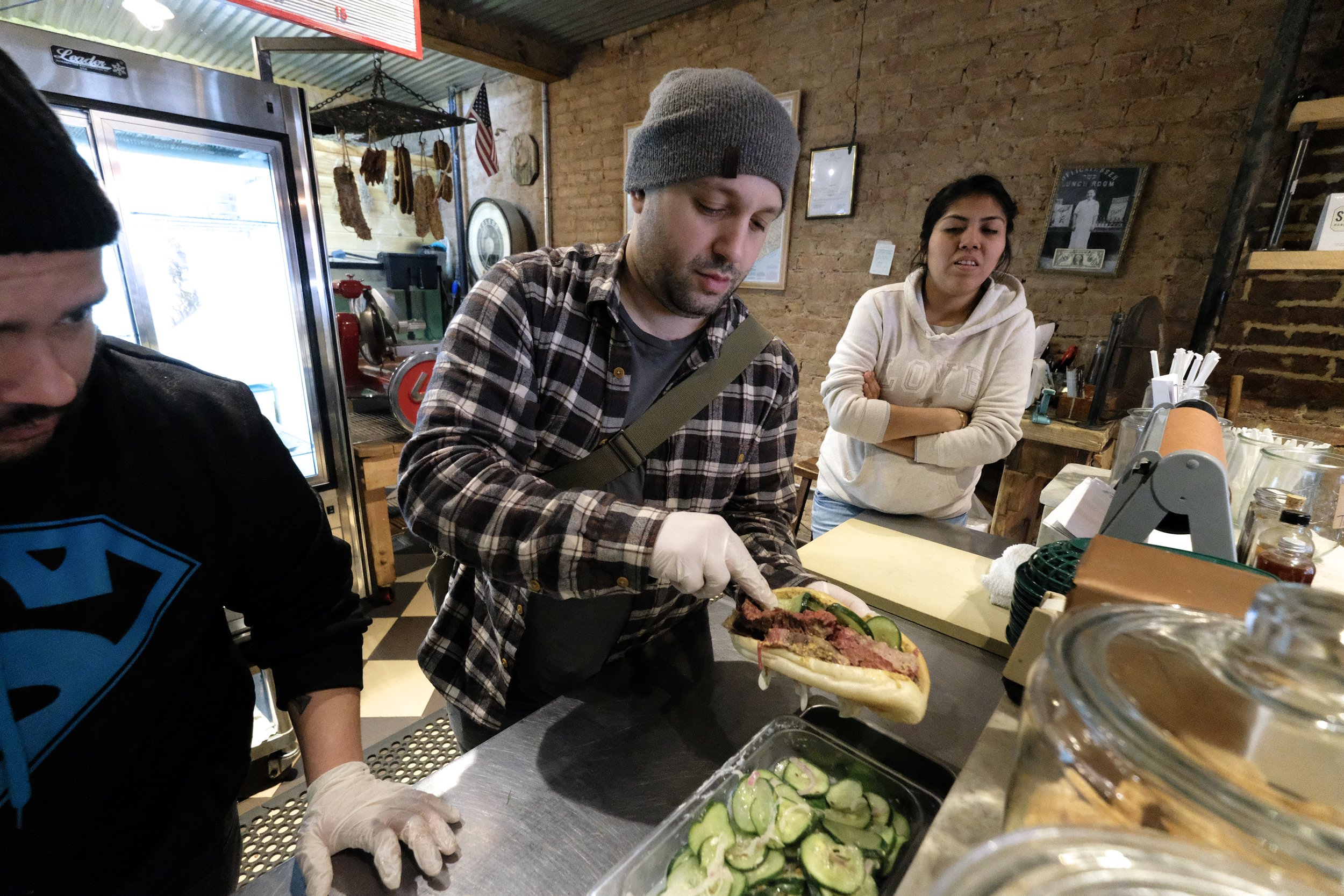 Vinny and Isle observe Will's preparation of my sandwich.