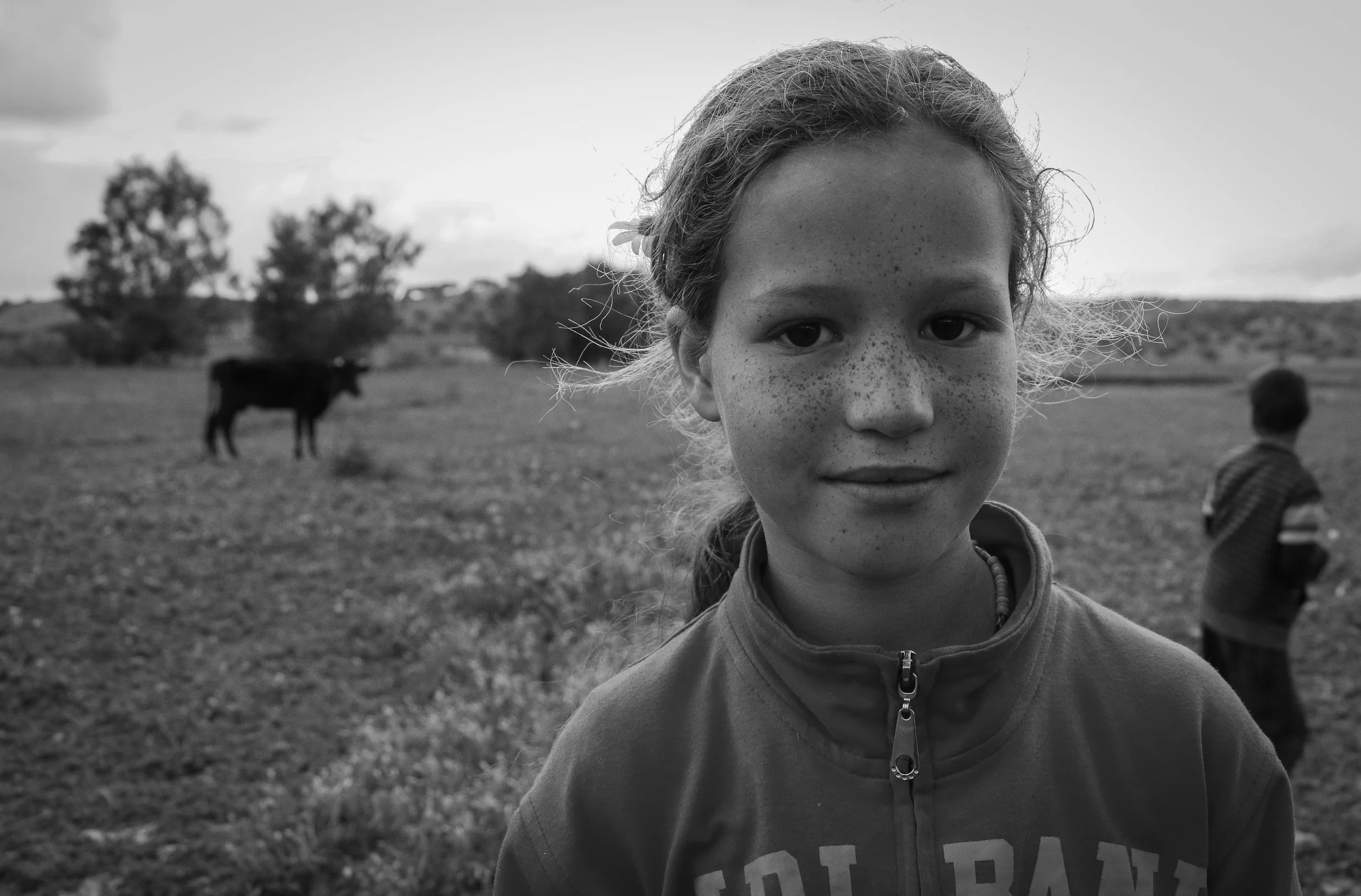 Salma, 10, is Nora's second oldest daughter. She often helps her mother with household chores, and mimicked her behavior, such as offering food, giving up her seat for guests, and tending to the smaller children of the village.