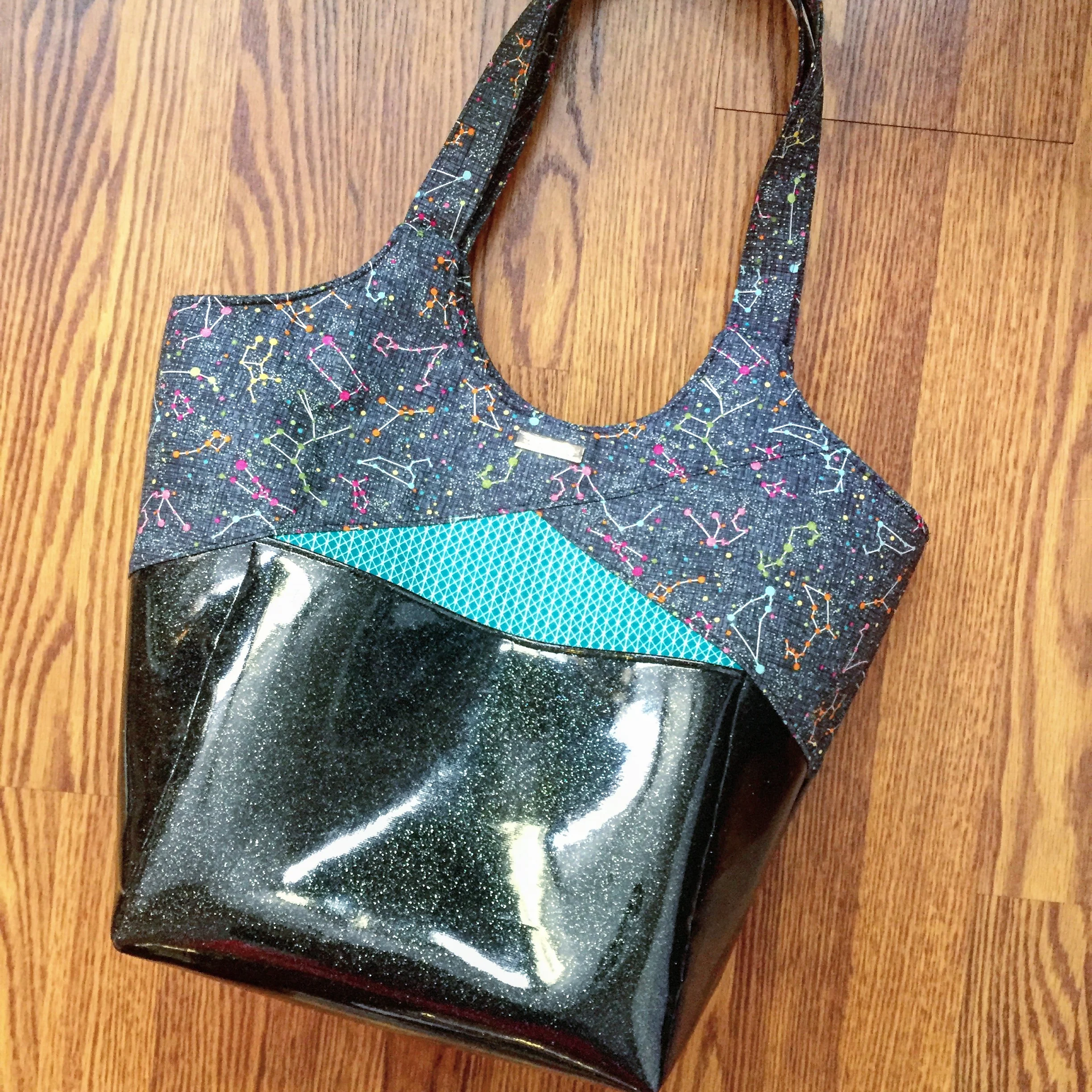 The Stand Up & Tote Notice pattern by Lisa Ratford of Two Pretty Poppets in sparkle vinyl. Constellation fabric by Timeless Treasures.