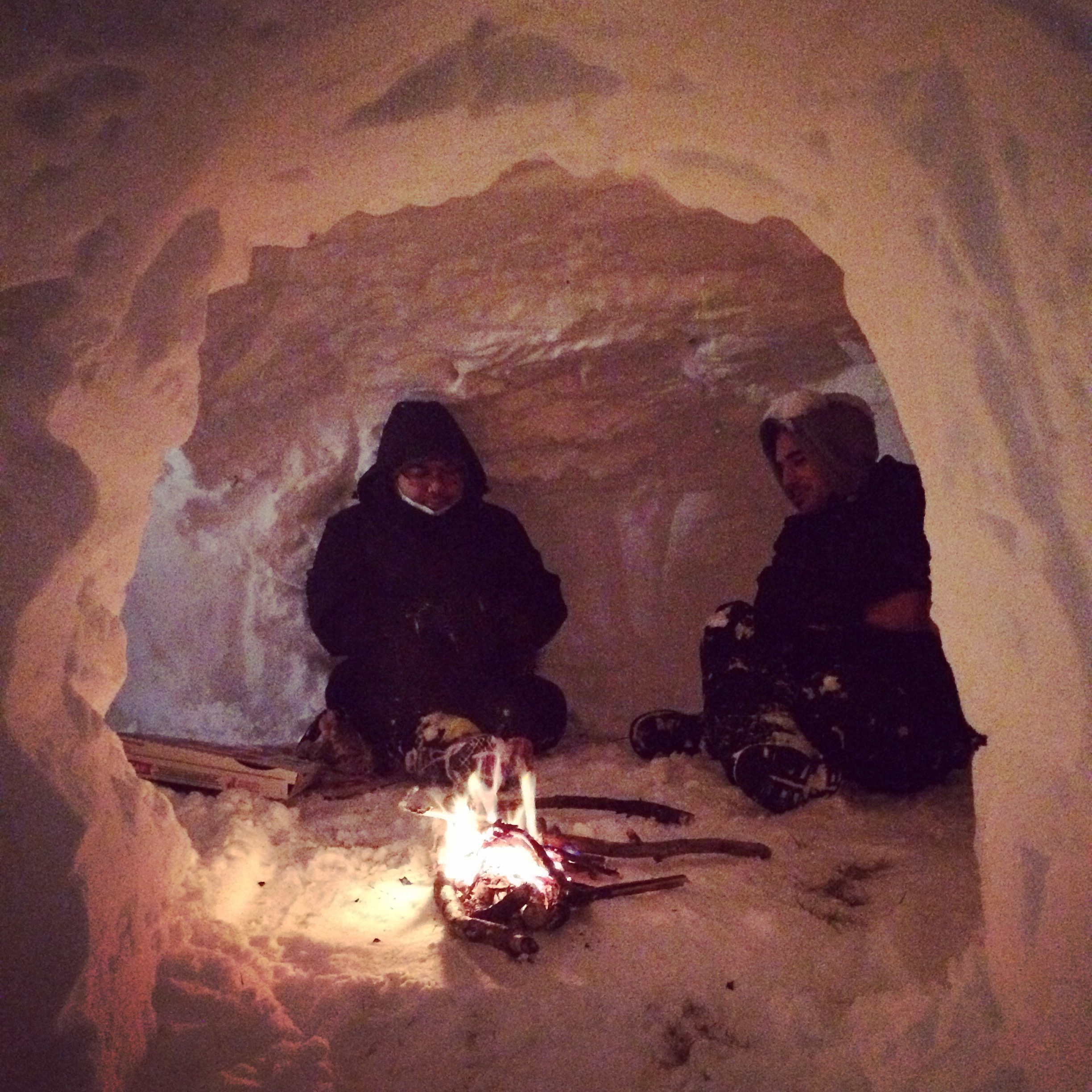Jesse and my brother Jon, keeping warm inside of the igloo we built.