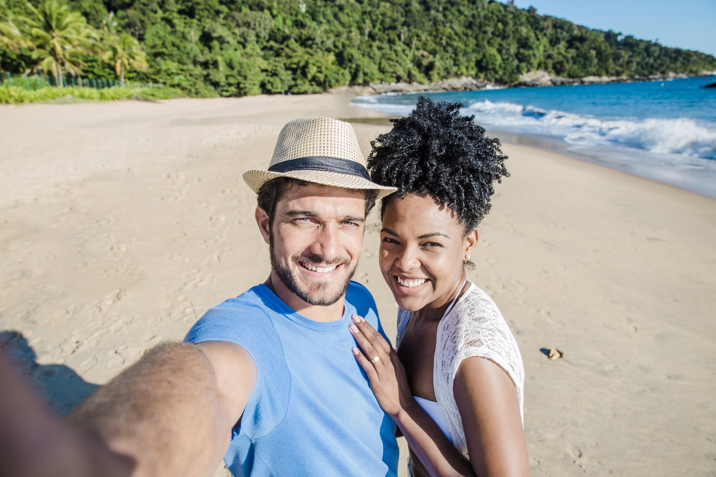 smiling-couple-making-selfie-beach-min.jpg