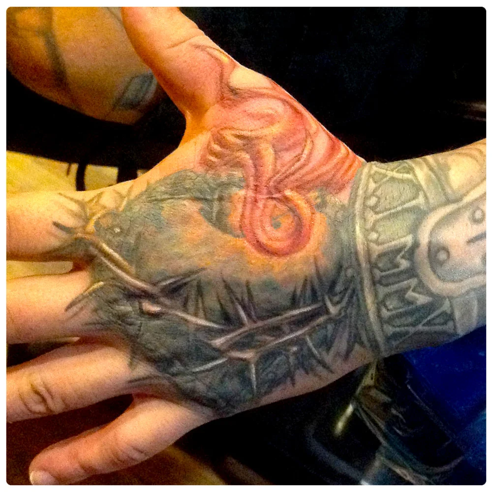 ig_2014_tattoo_hand-flames.jpg