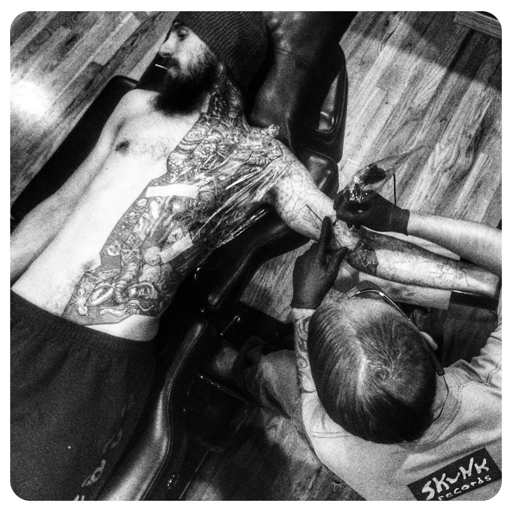 Shane working on Josh’s arm sleeve. Body part coverage list: Neck, Shoulder, Chest, Nipple, Back, Ribs, Stomach, Armpit, Upper Arm, Lower Arm, Hand and even three Fingers!