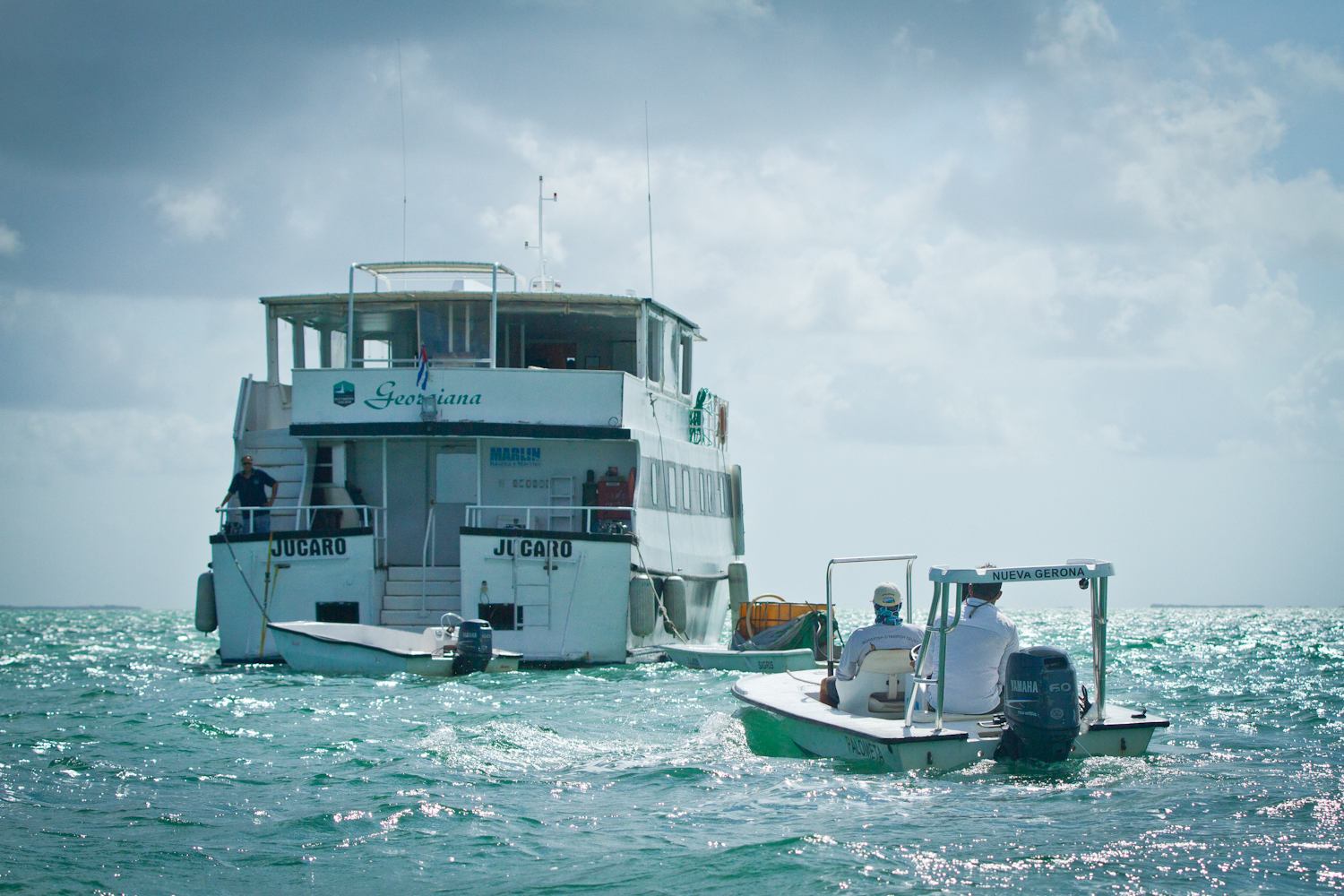 Flats skiff returning to the Georgiana after a full day of fishing around Zapata