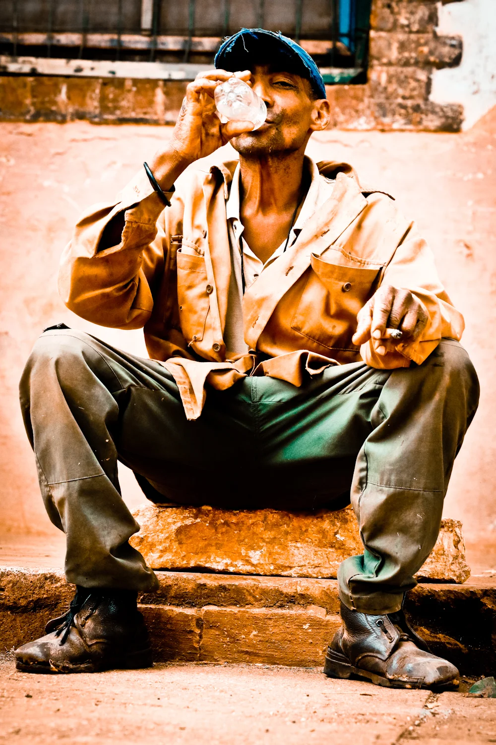 Look at this guy, and you see Cuba. Just off his shift from the sugar cane processing mill, his clothes seem to reflect the colors of the revolution. With the cigar in his hand, and boots that have seen better days, he represents his "Pueblo." 