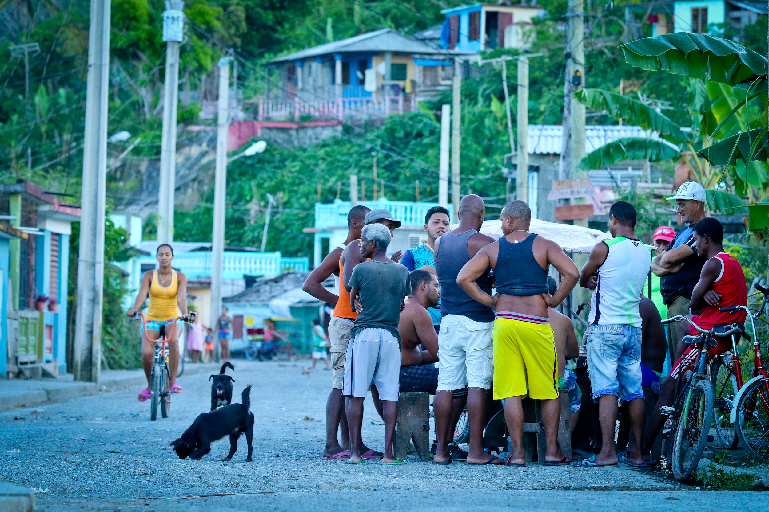 Men playing "tiles" on a backstreet in Baracoa.