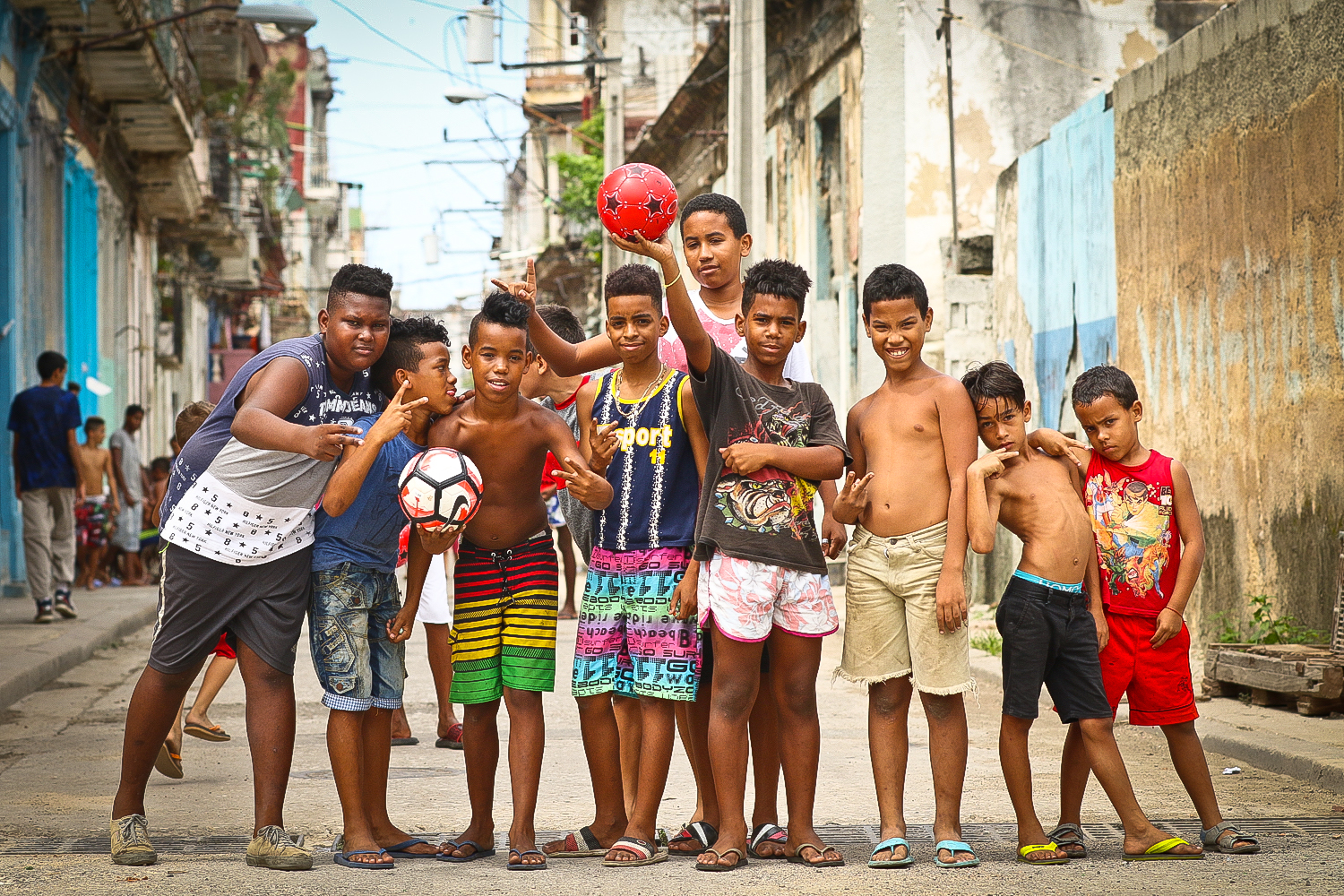 A great group of kids, they were playing marbles on this dirty side street when I came across them. Happy, grateful, and polite to be getting a few soccer balls from the USA.