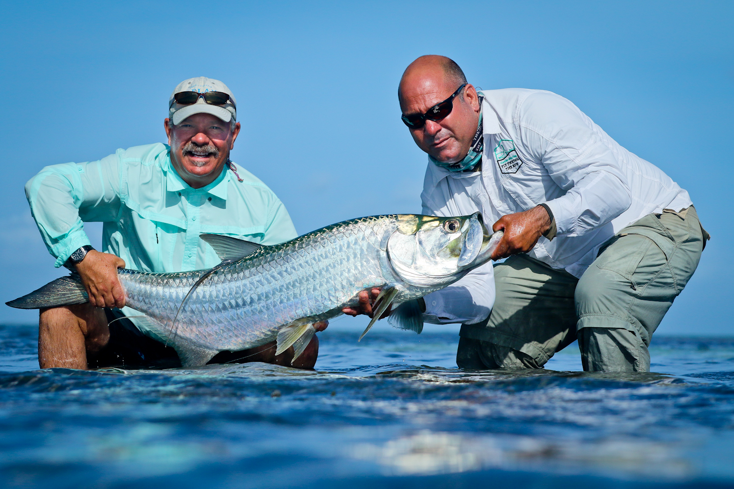 Tim Cudney and our guide Elyses with a perfect Tarpon from GOK