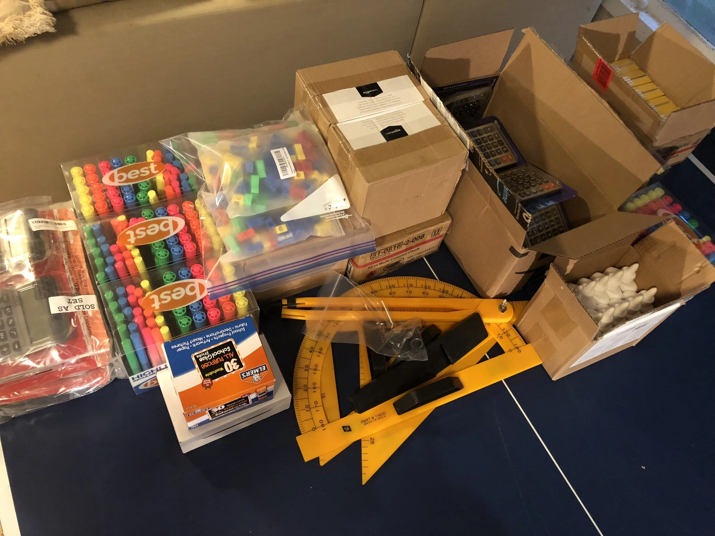Calculators, hi-lighters, glue, pencil sharpeners, erasers, colored chalk and geometry tools