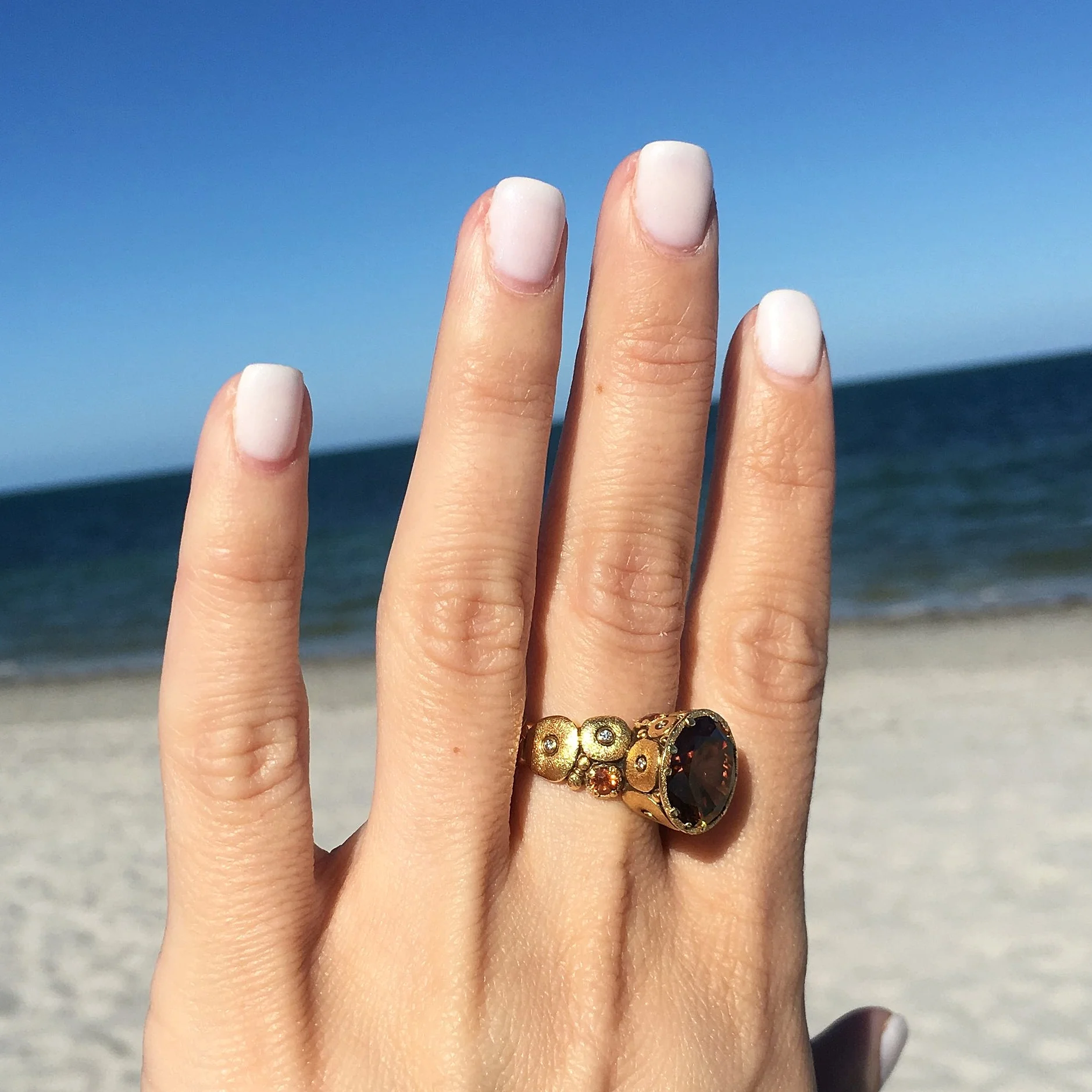 Alex Sepkus R-115 Orchard ring with Zircon. Ornately carved 18K yellow gold band with diamonds and sapphires, set with opulent brown zircon.