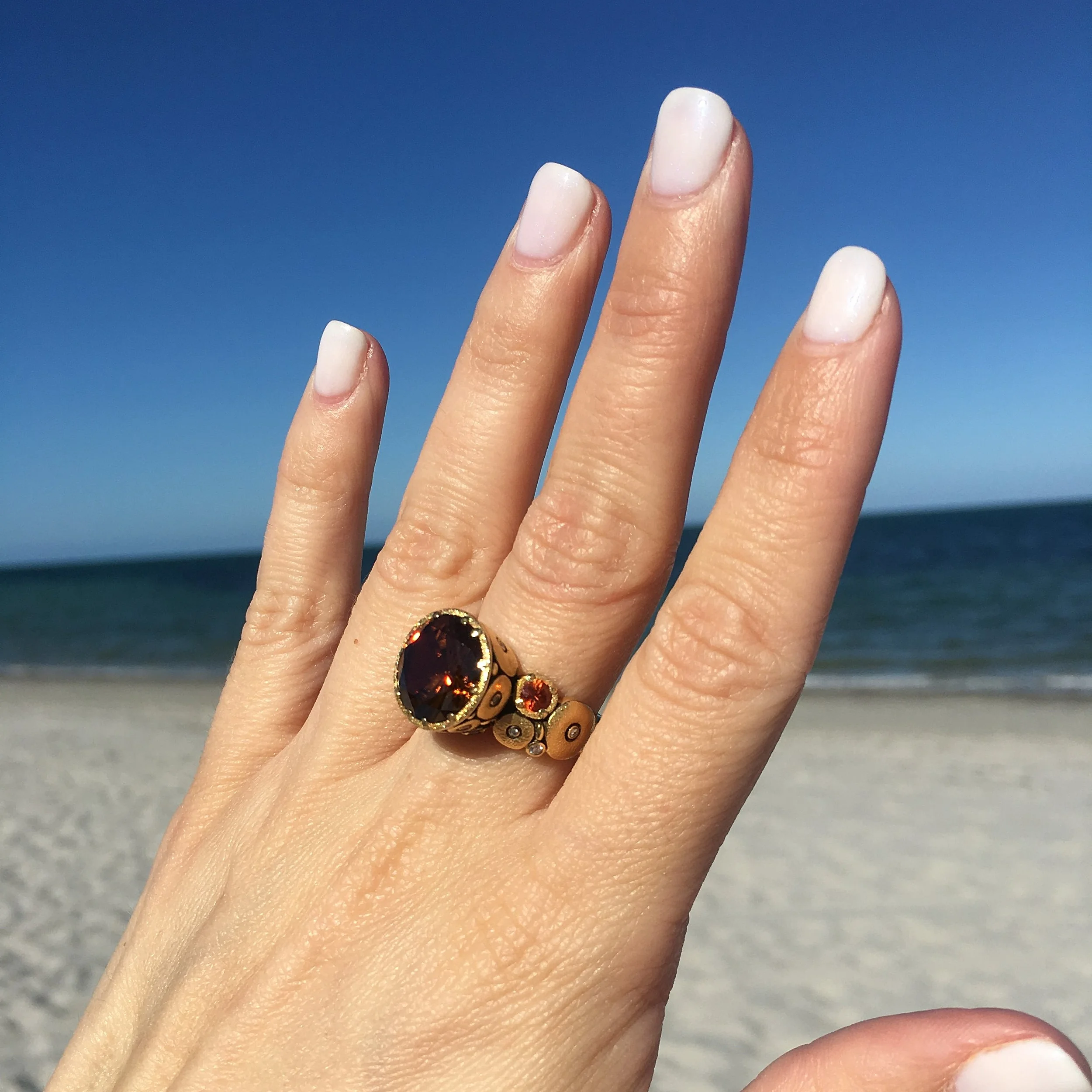 Alex Sepkus R-115 Orchard ring with Zircon. Ornately carved 18K yellow gold band with diamonds and sapphires, set with opulent brown zircon.