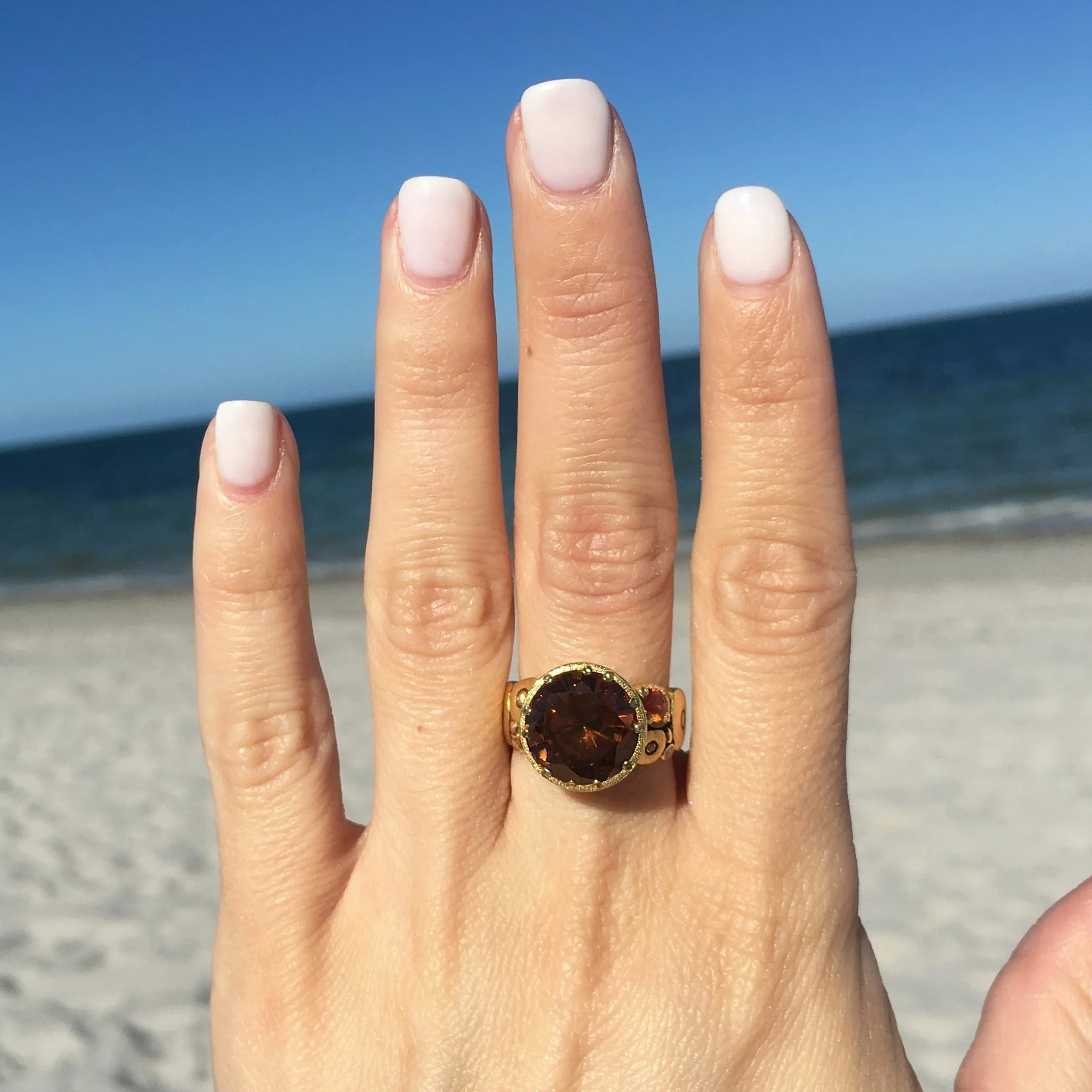 Alex Sepkus R-115 Orchard ring with Zircon. Ornately carved 18K yellow gold band with diamonds and sapphires, set with opulent brown zircon.