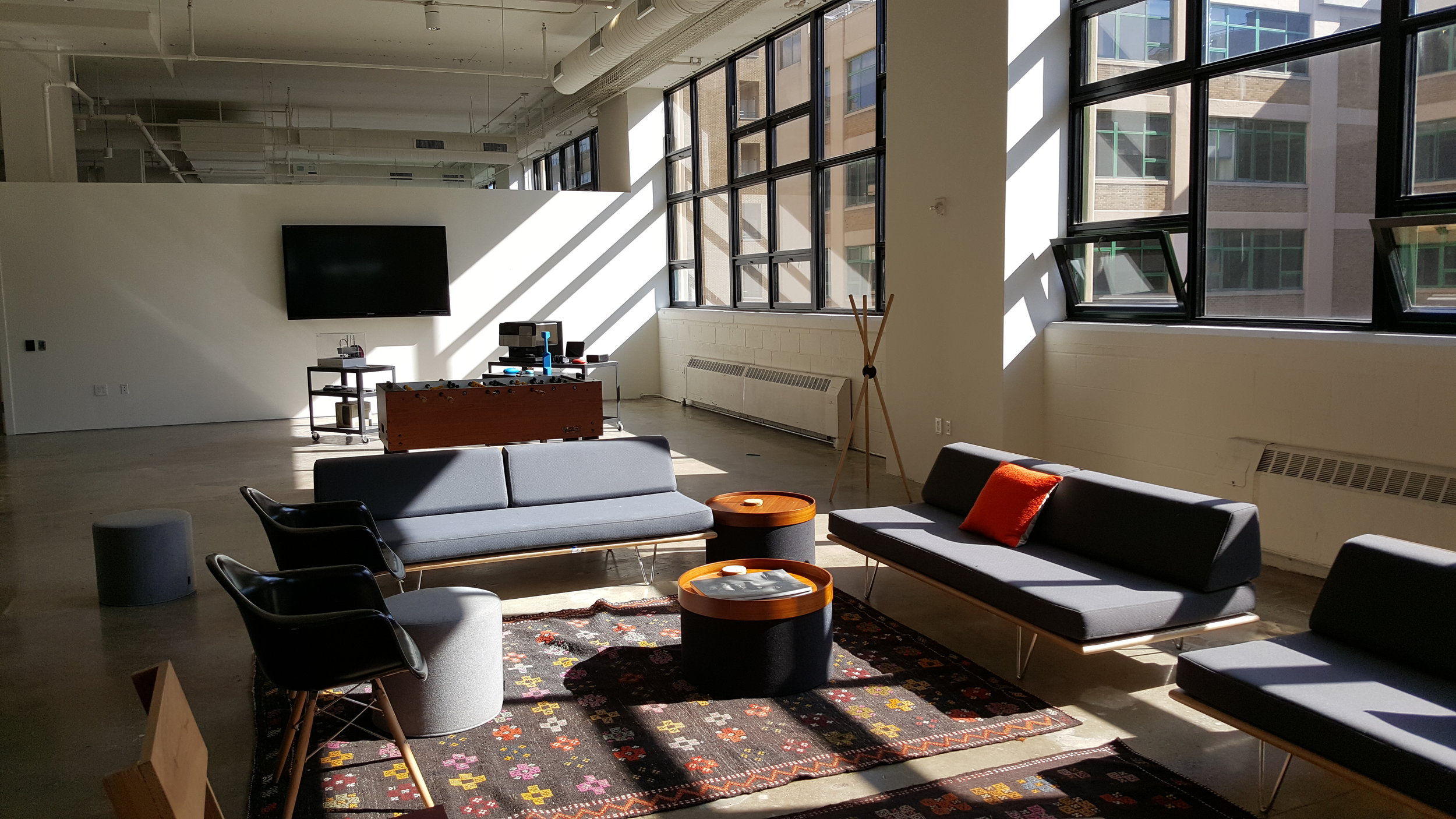 Modular furnishings support multiple activities. A gallery area in the rear showcases work by frog and other area firms.