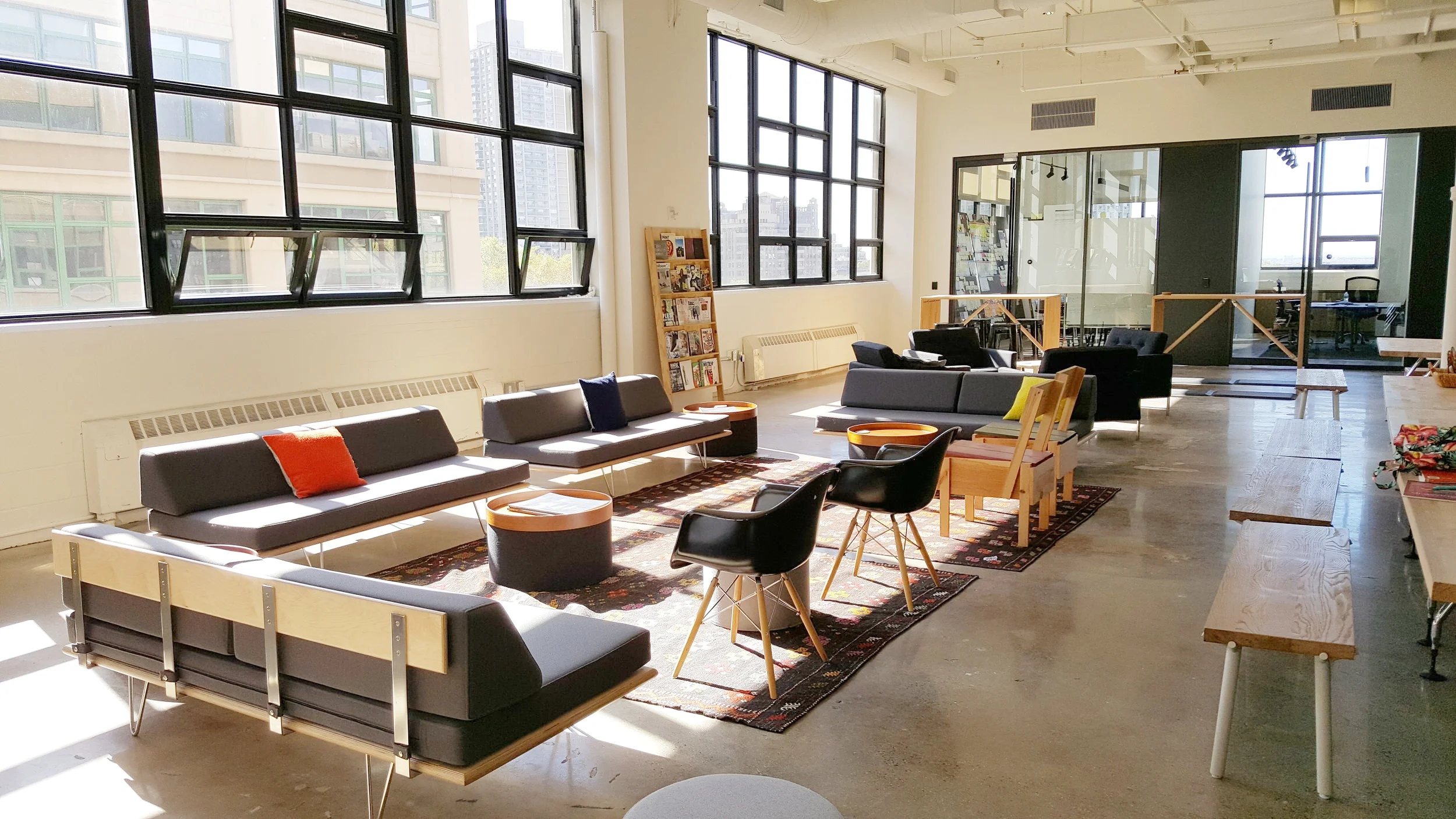 Frog's large open team room is a favorite space to relax or informally collaborate. A wall of windows and a 15.5 foot ceiling fill the space with light and views.