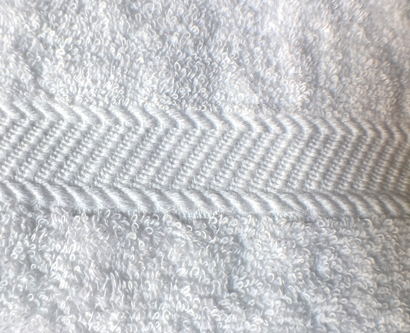 Diagonal dobby border detail.